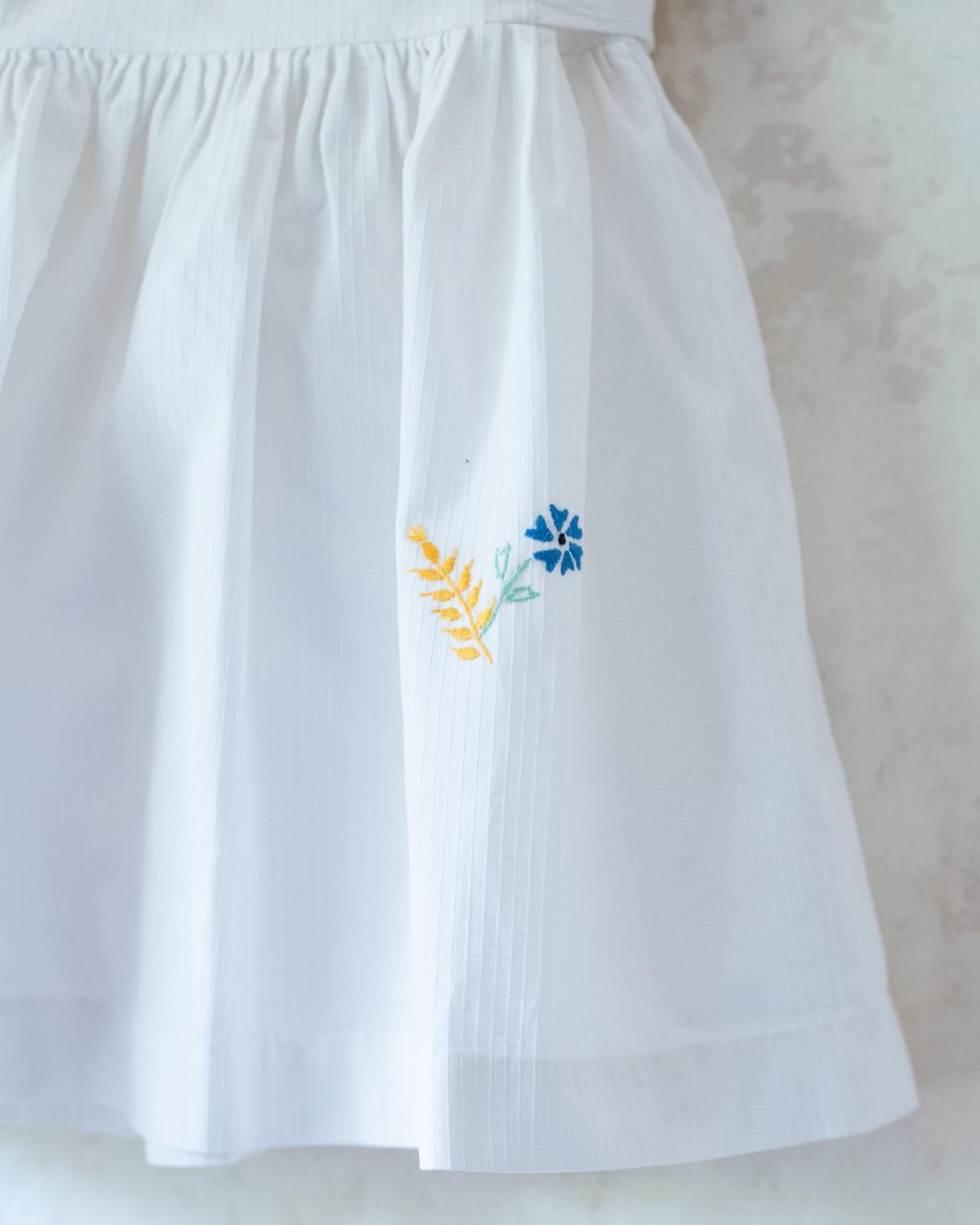 White dress with flower and cornflower embroidery | 12-18 months