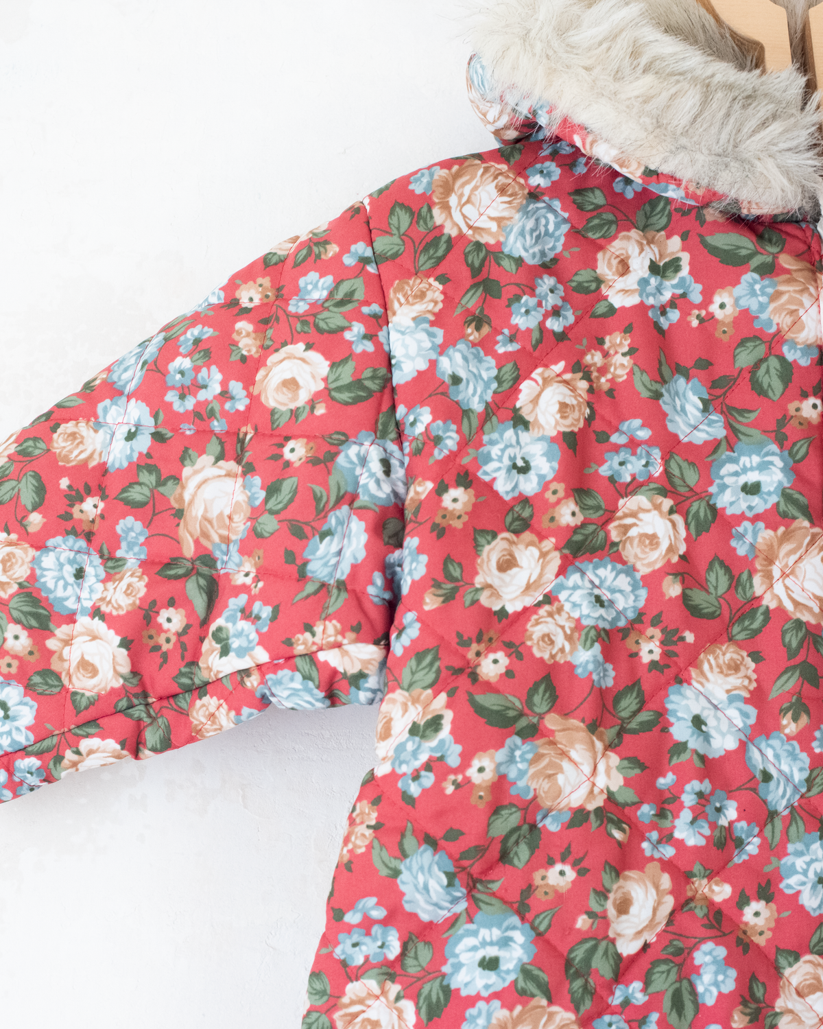 Floral snowsuit with a fur hood | 12-18 months