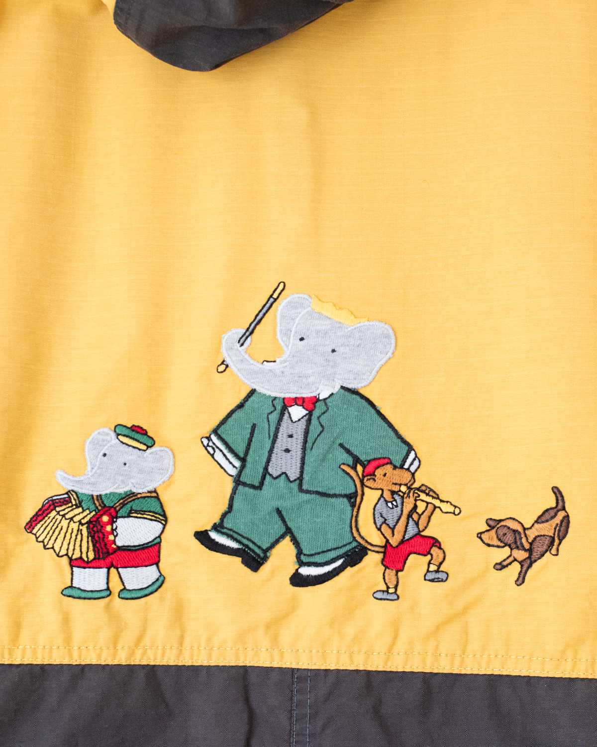 Brown and yellow jacket with embroideries of the King in Bubber | 5-6 years