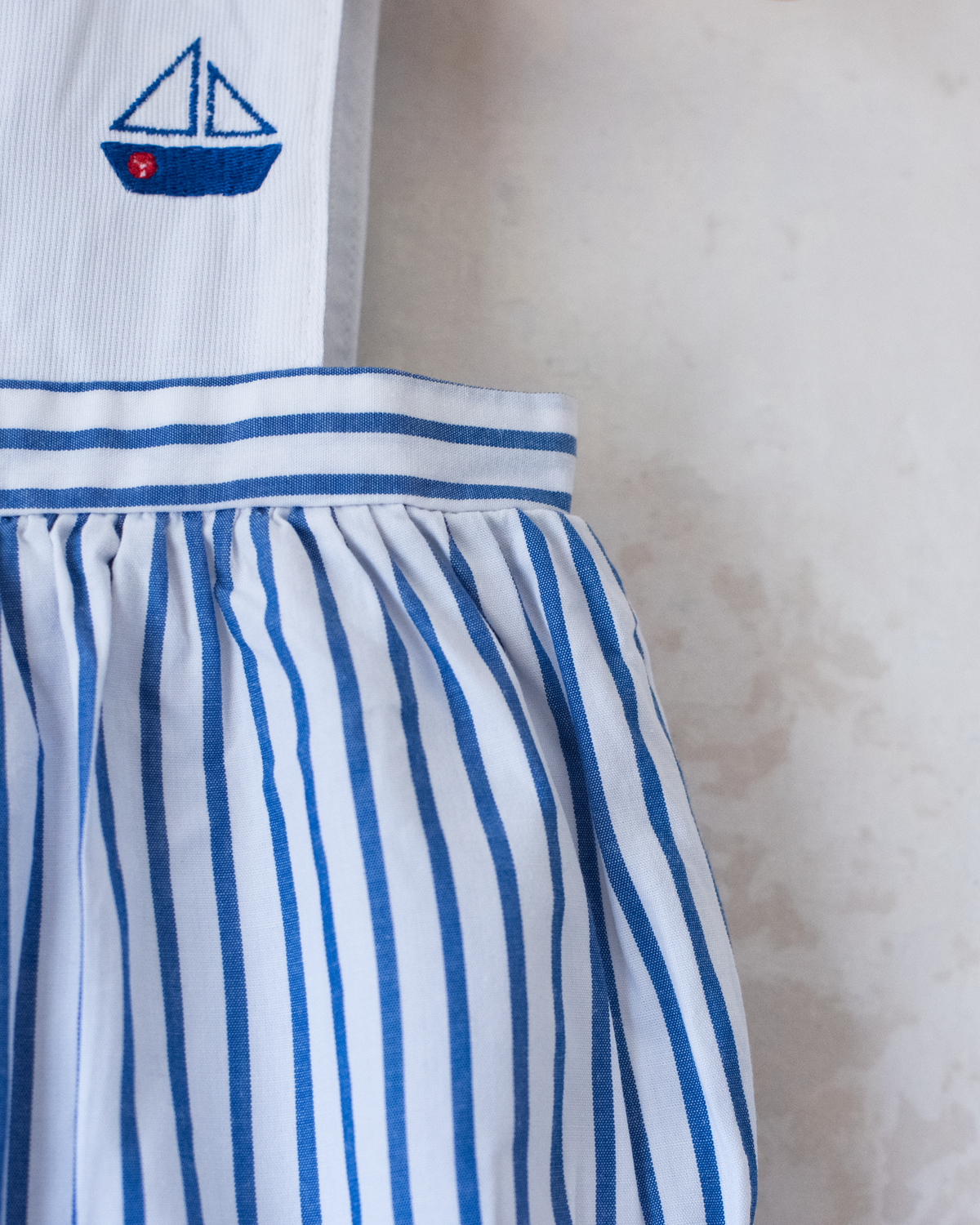 Jumpsuit with stripes and embroidered sailboats | 0-3 months