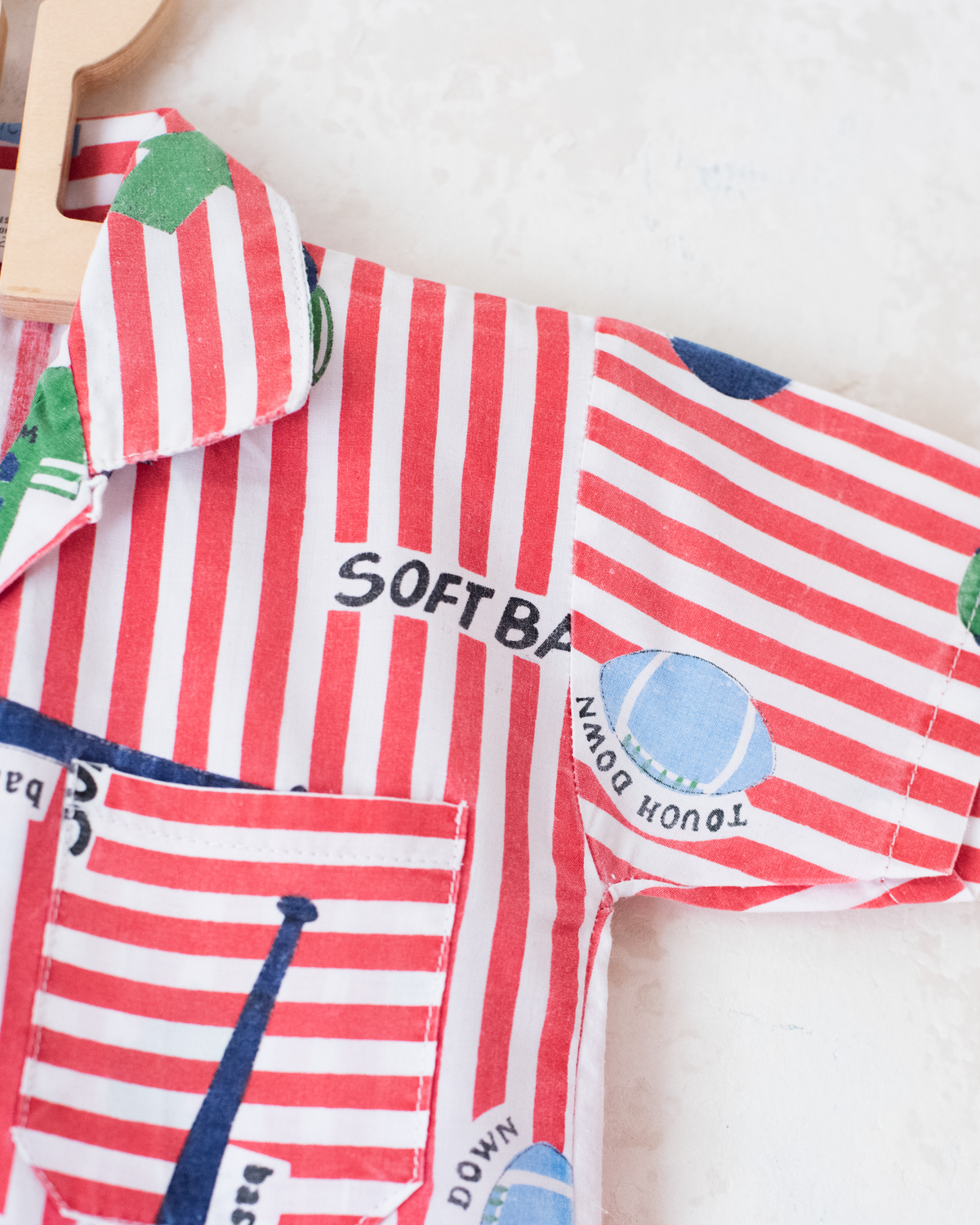 Striped button-down shirt with sports prints | 2-3 years
