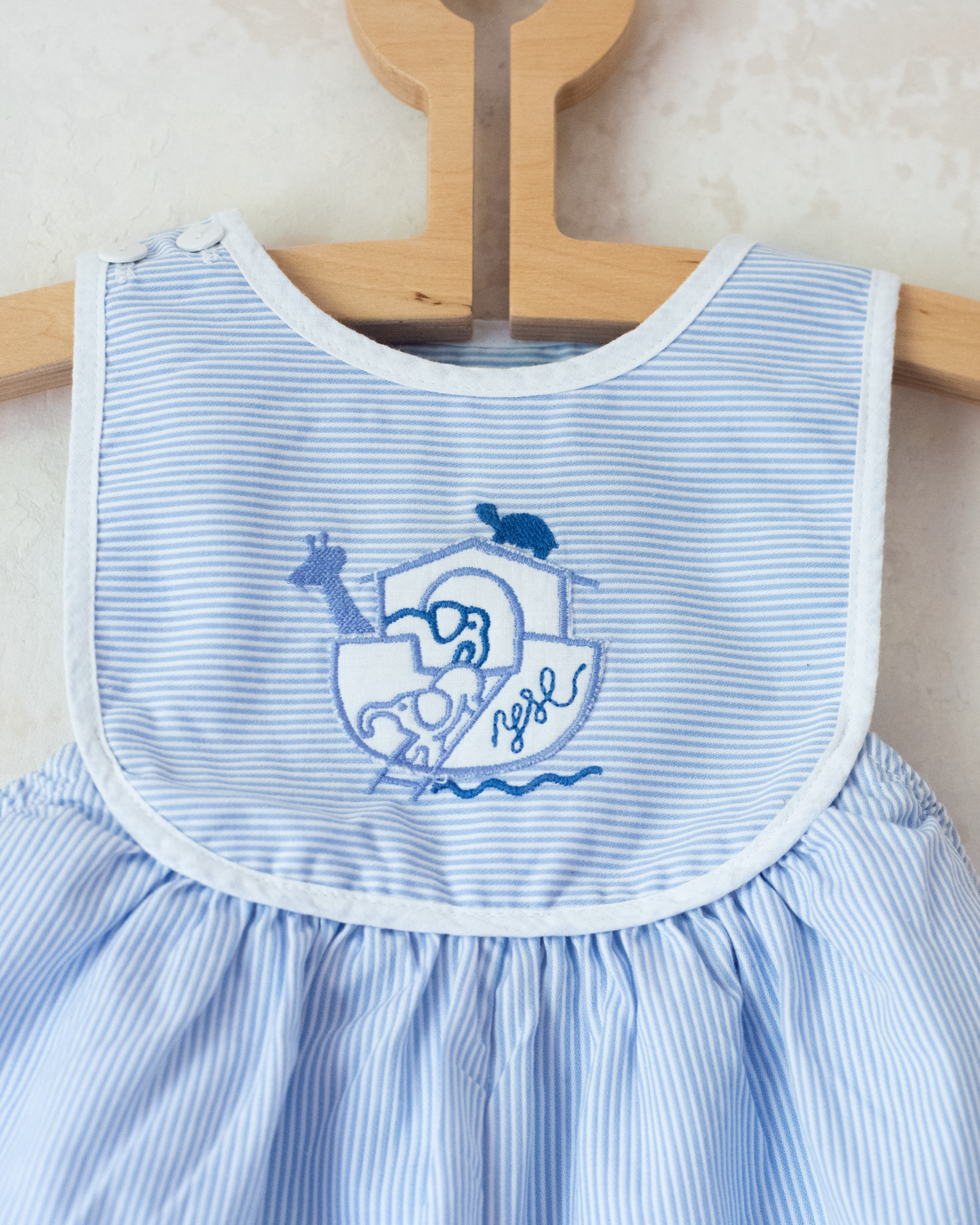 Striped jumpsuit with embroidered comforter from Yves Saint Laurent | 9-12 months
