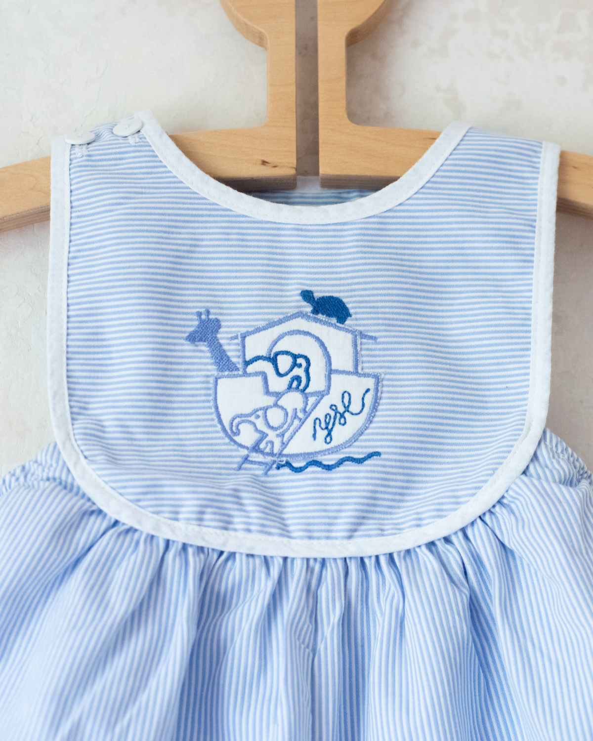 Striped jumpsuit with embroidered comforter from Yves Saint Laurent | 9-12 months
