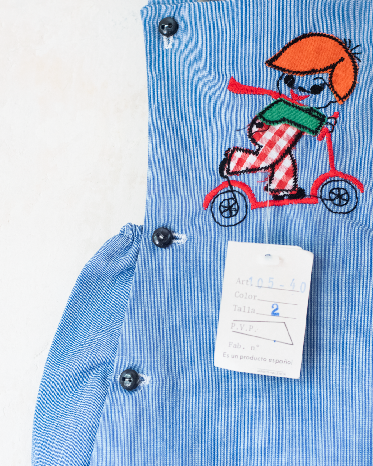 Blue romper with a boy riding a scooter | Spanish Deadstock | 12-18 months