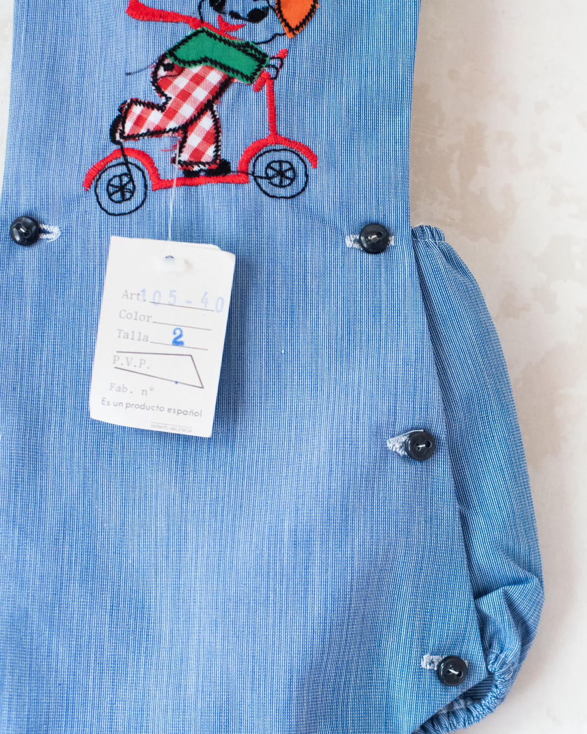 Blue romper with a boy riding a scooter | Spanish Deadstock | 12-18 months