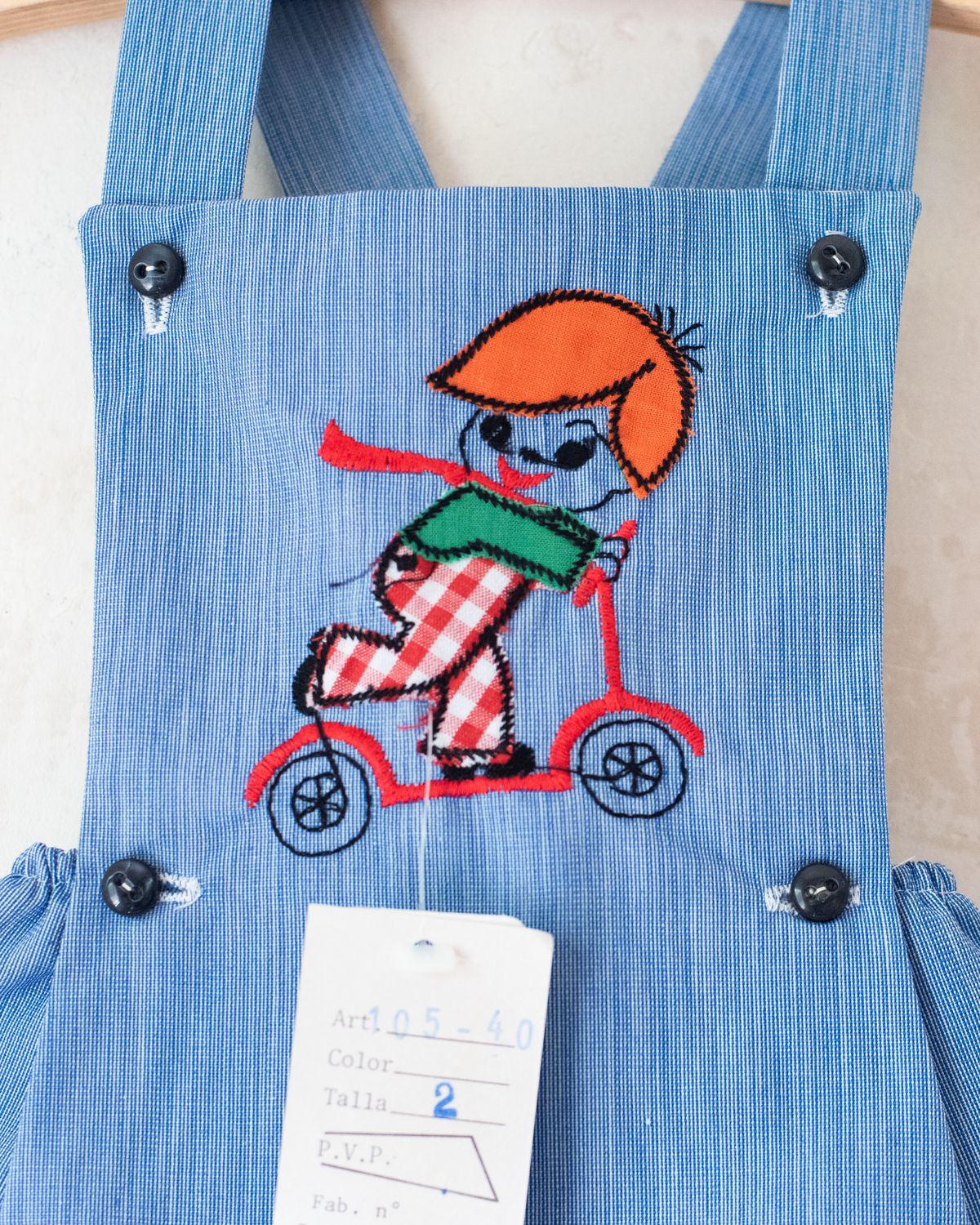 Blue romper with a boy riding a scooter | Spanish Deadstock | 12-18 months