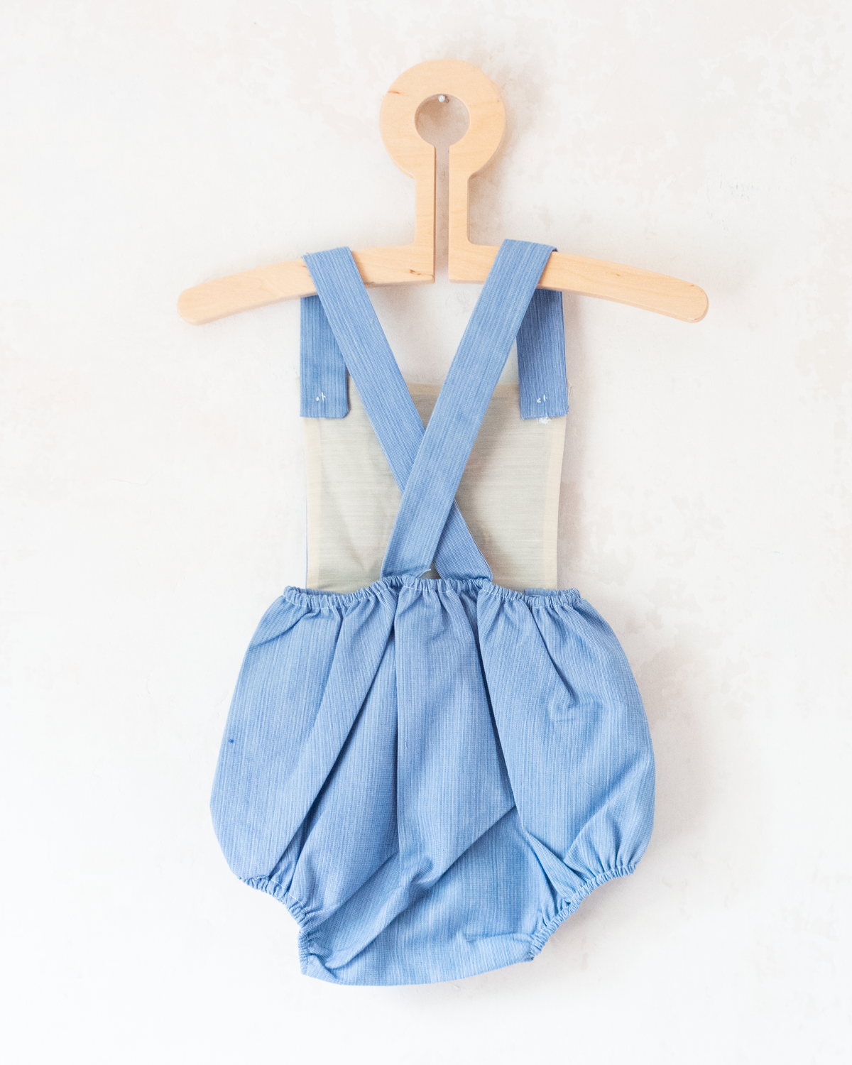 Blue romper with a boy riding a scooter | Spanish Deadstock | 12-18 months