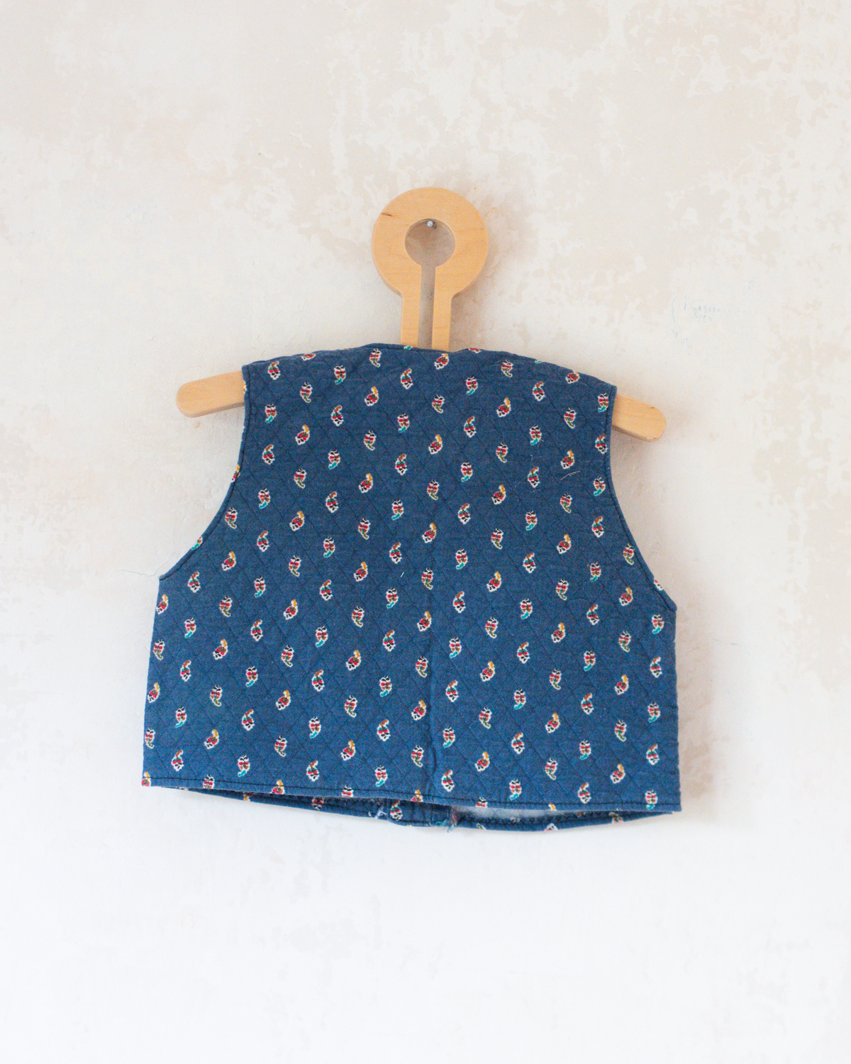 Blue vest with colorful paisley | 12-18 months