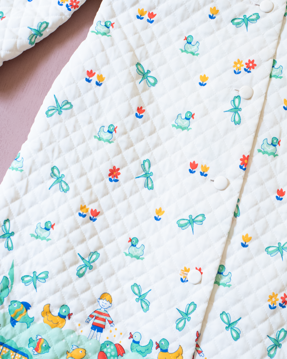 Synthetic jacket with nostalgic prints | 7-8 years