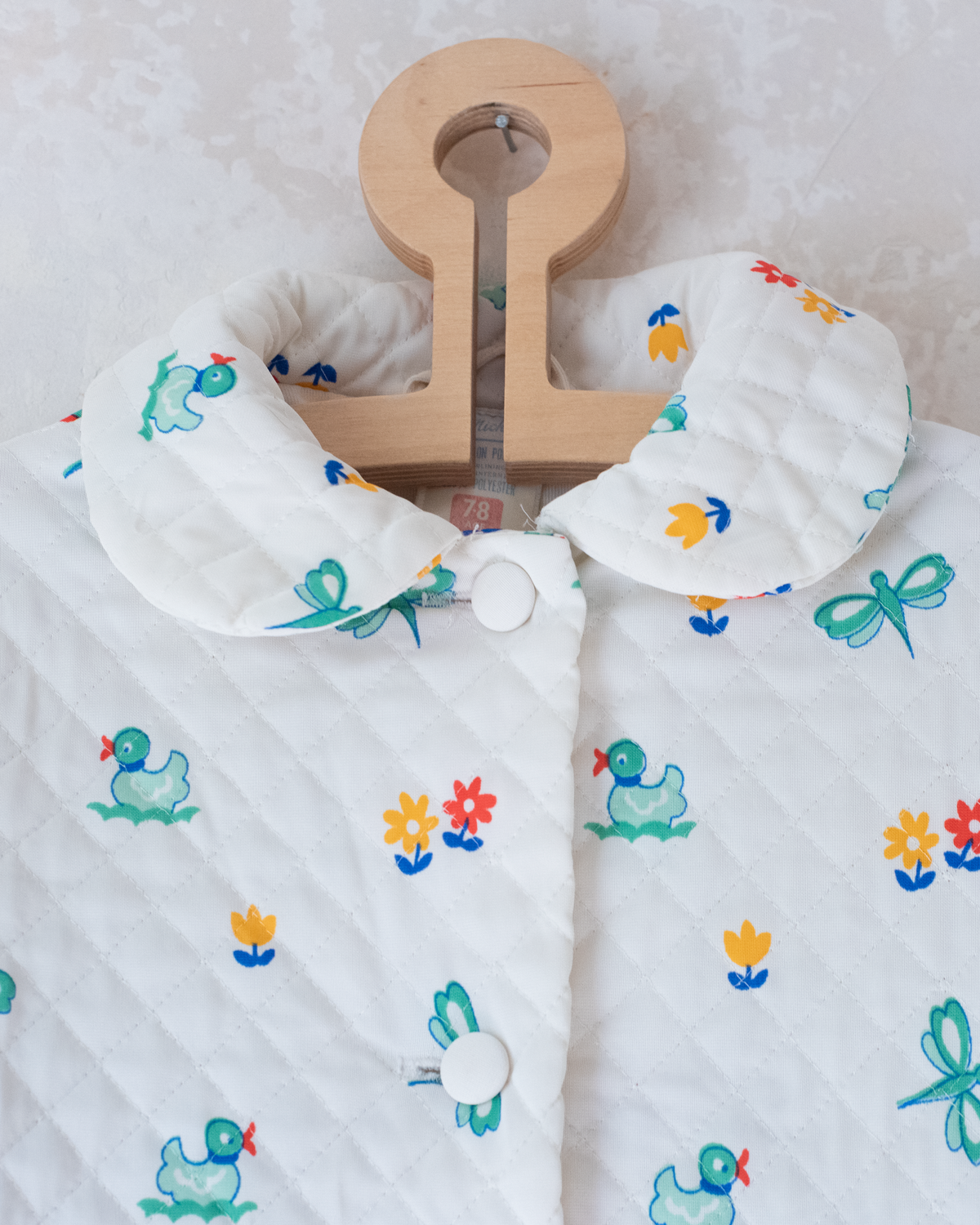 Synthetic jacket with nostalgic prints | 7-8 years