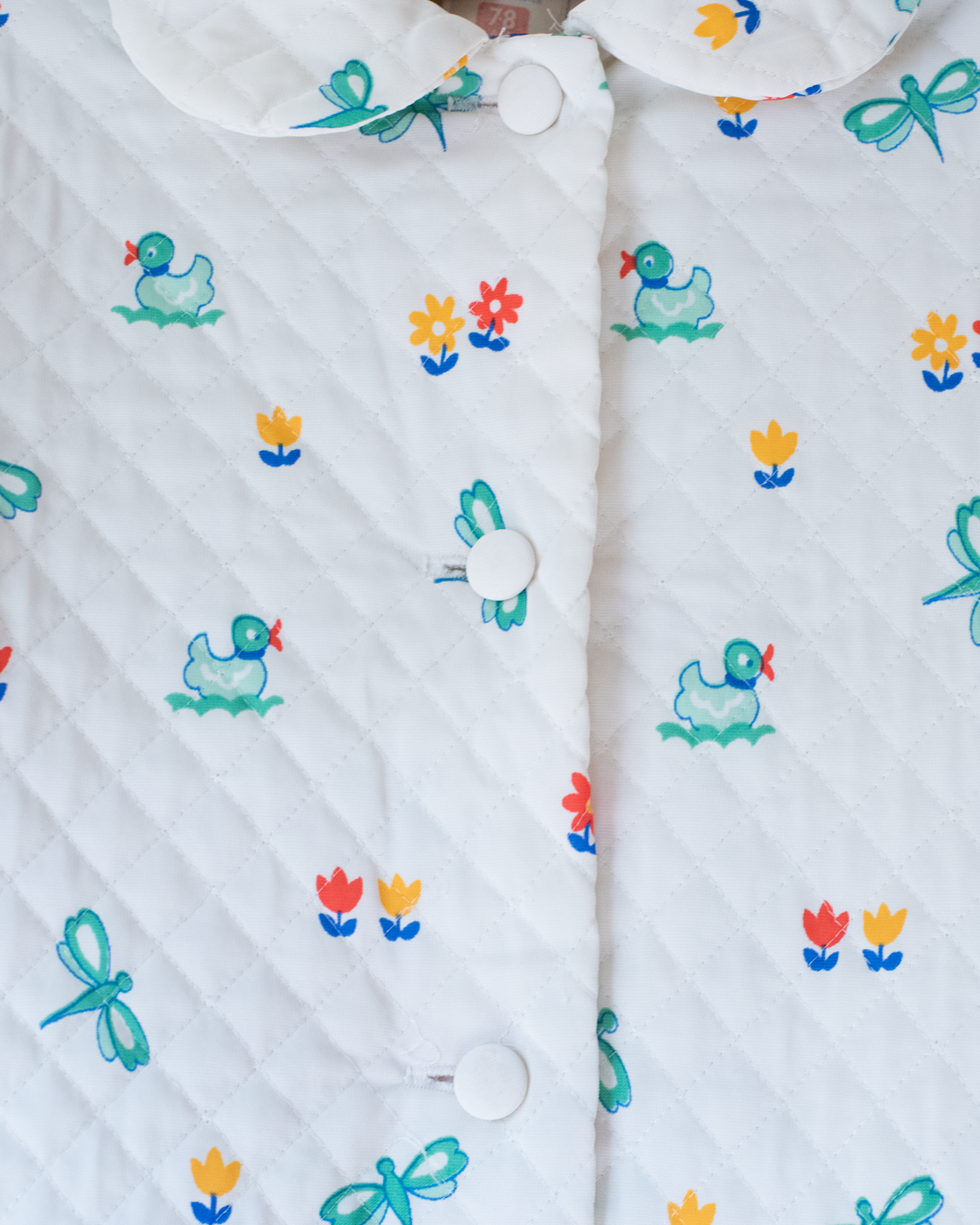 Synthetic jacket with nostalgic prints | 7-8 years