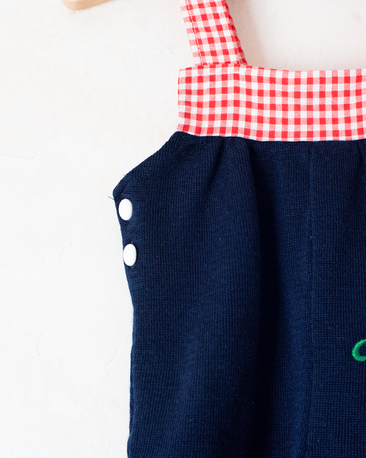 Short checkered romper with an embroidered horse | 0-3 months