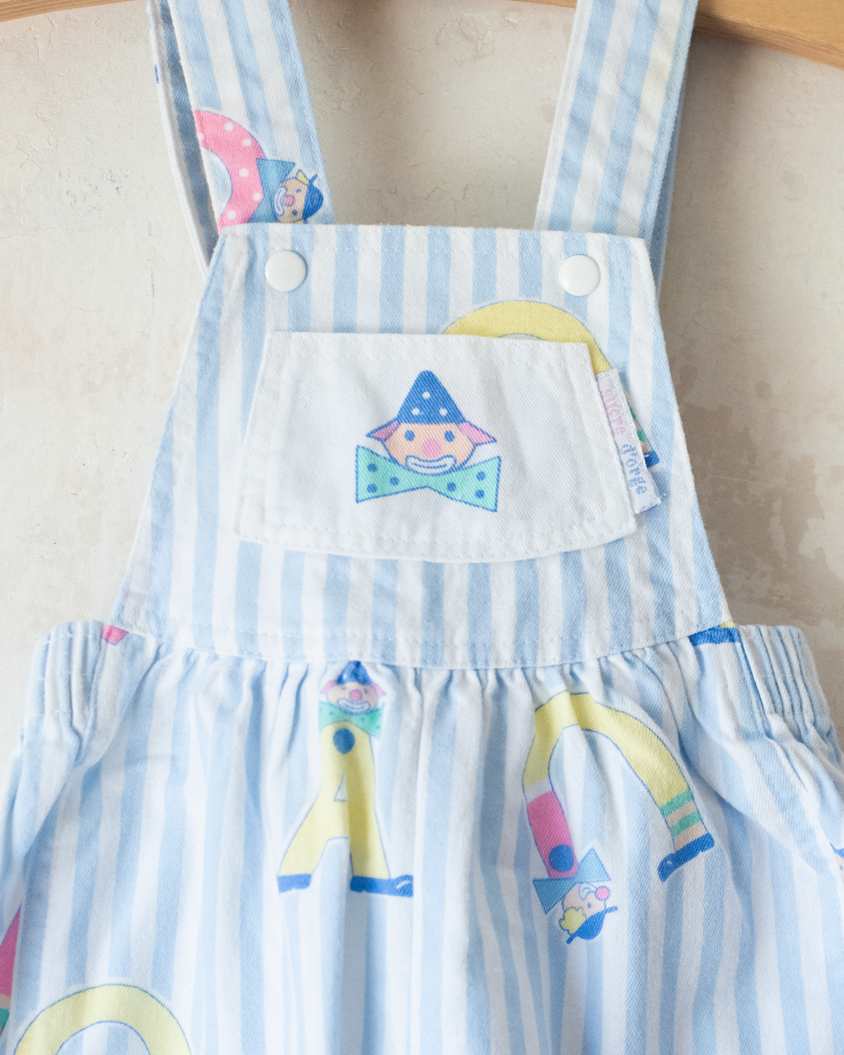 Jumpsuit with stripes and clowns | 6-9 months