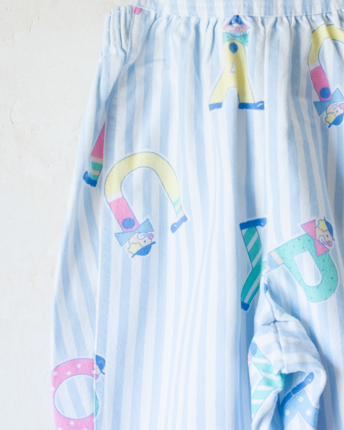 Jumpsuit with stripes and clowns | 6-9 months
