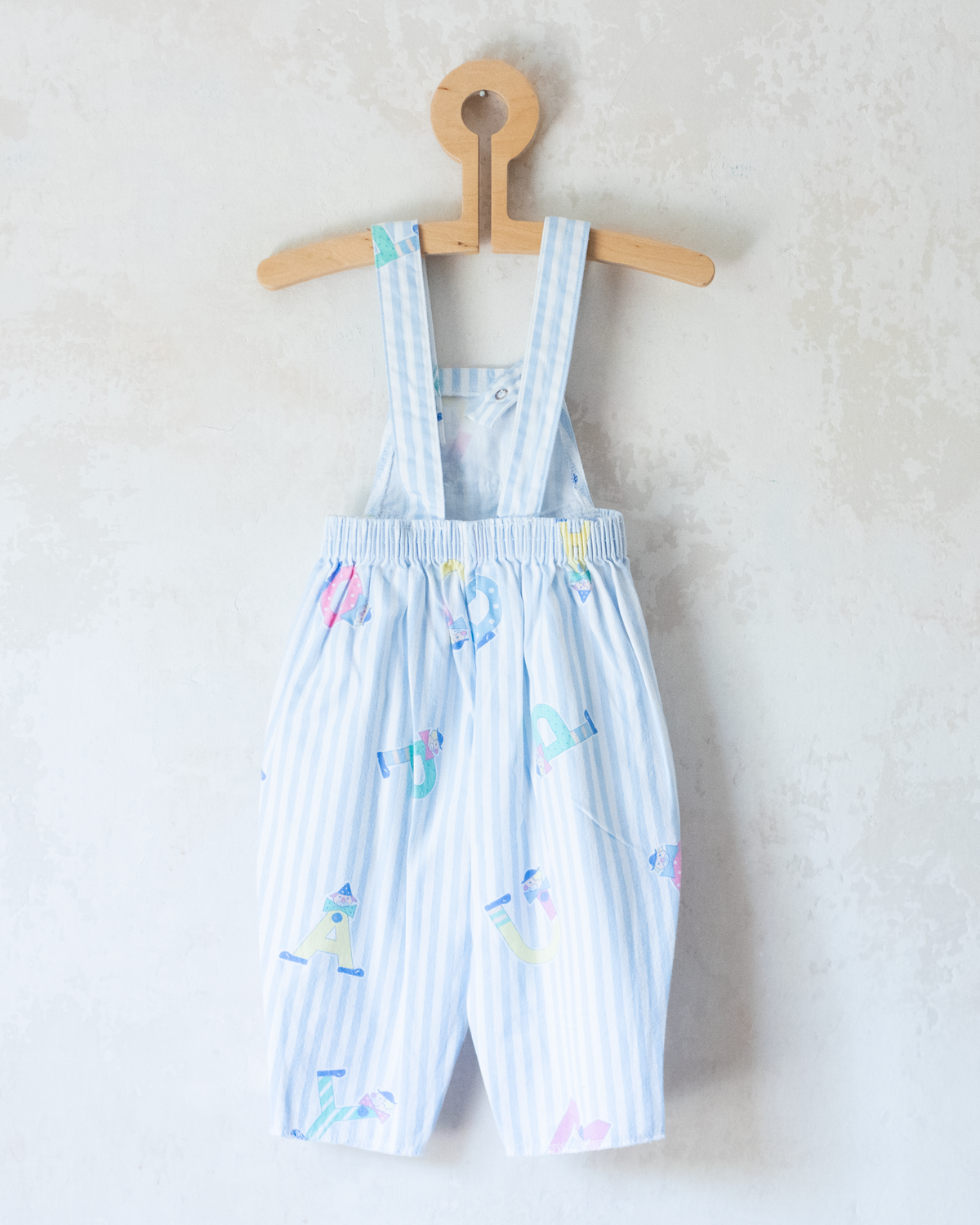 Jumpsuit with stripes and clowns | 6-9 months