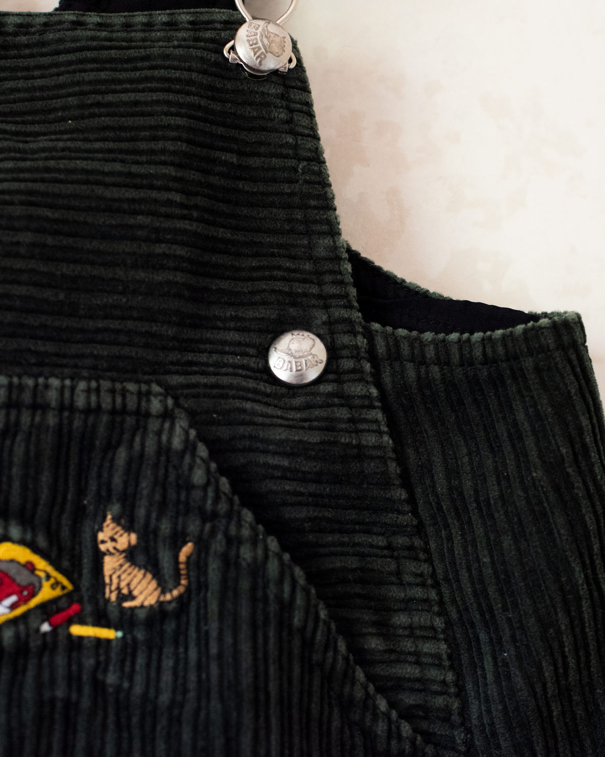 Green corduroy sarafan with colorful embroidery of the King in the Bar | 18-24 months