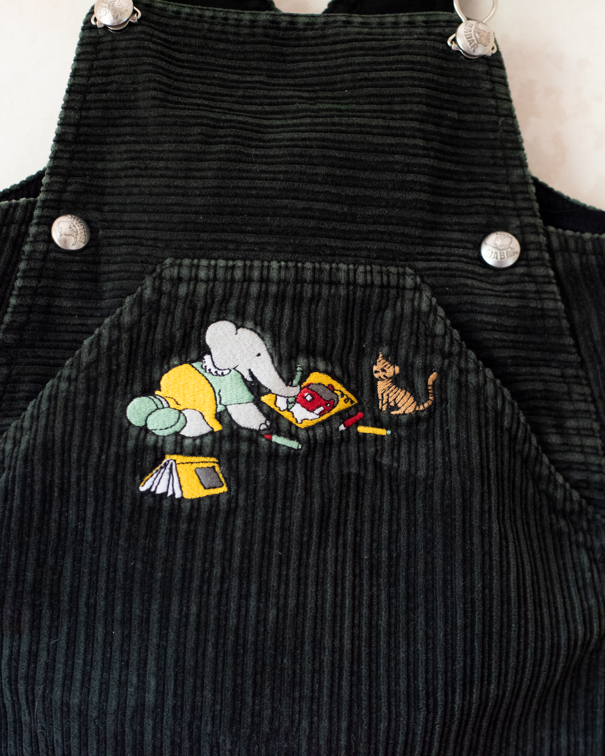 Green corduroy sarafan with colorful embroidery of the King in the Bar | 18-24 months