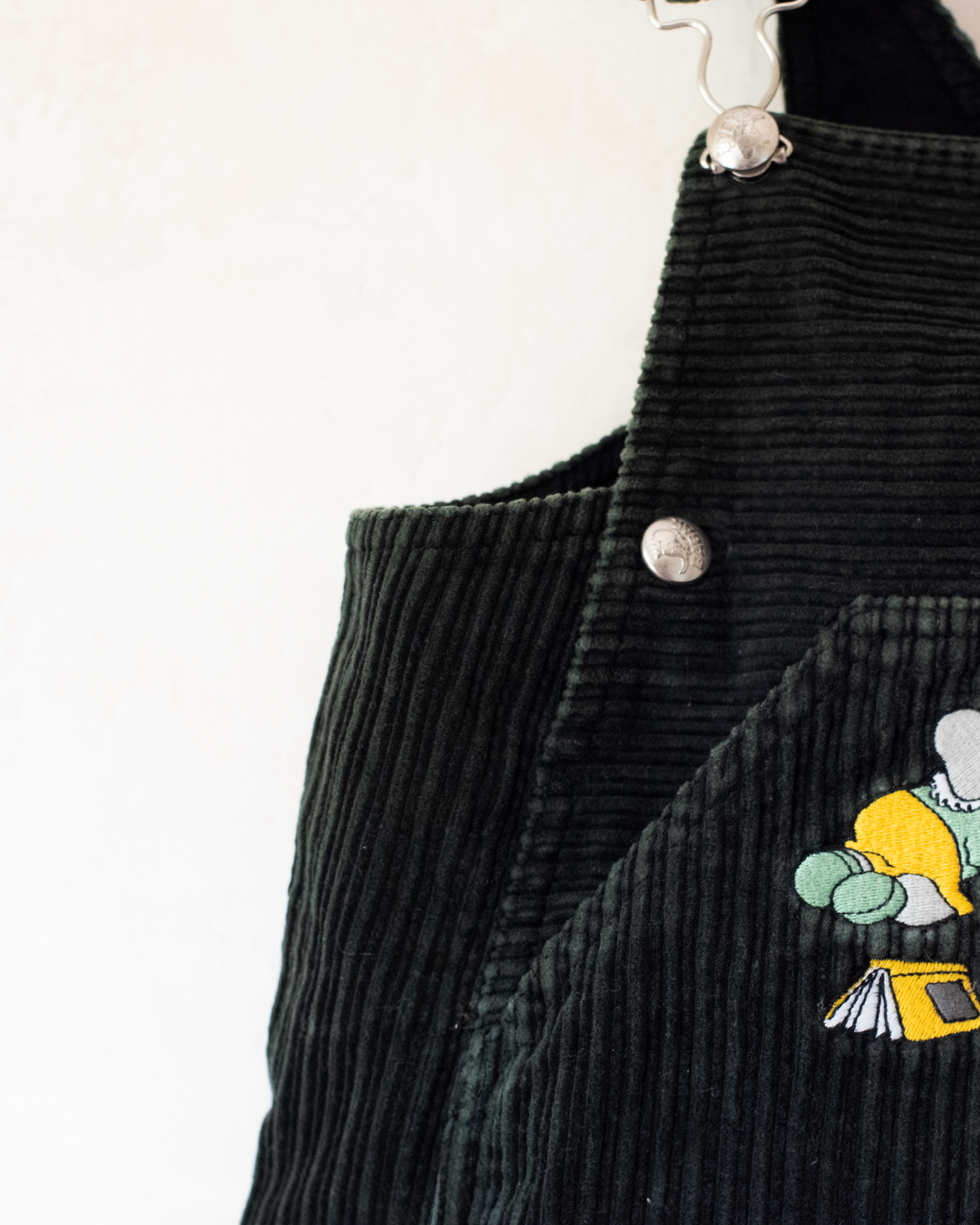 Green corduroy sarafan with colorful embroidery of the King in the Bar | 18-24 months