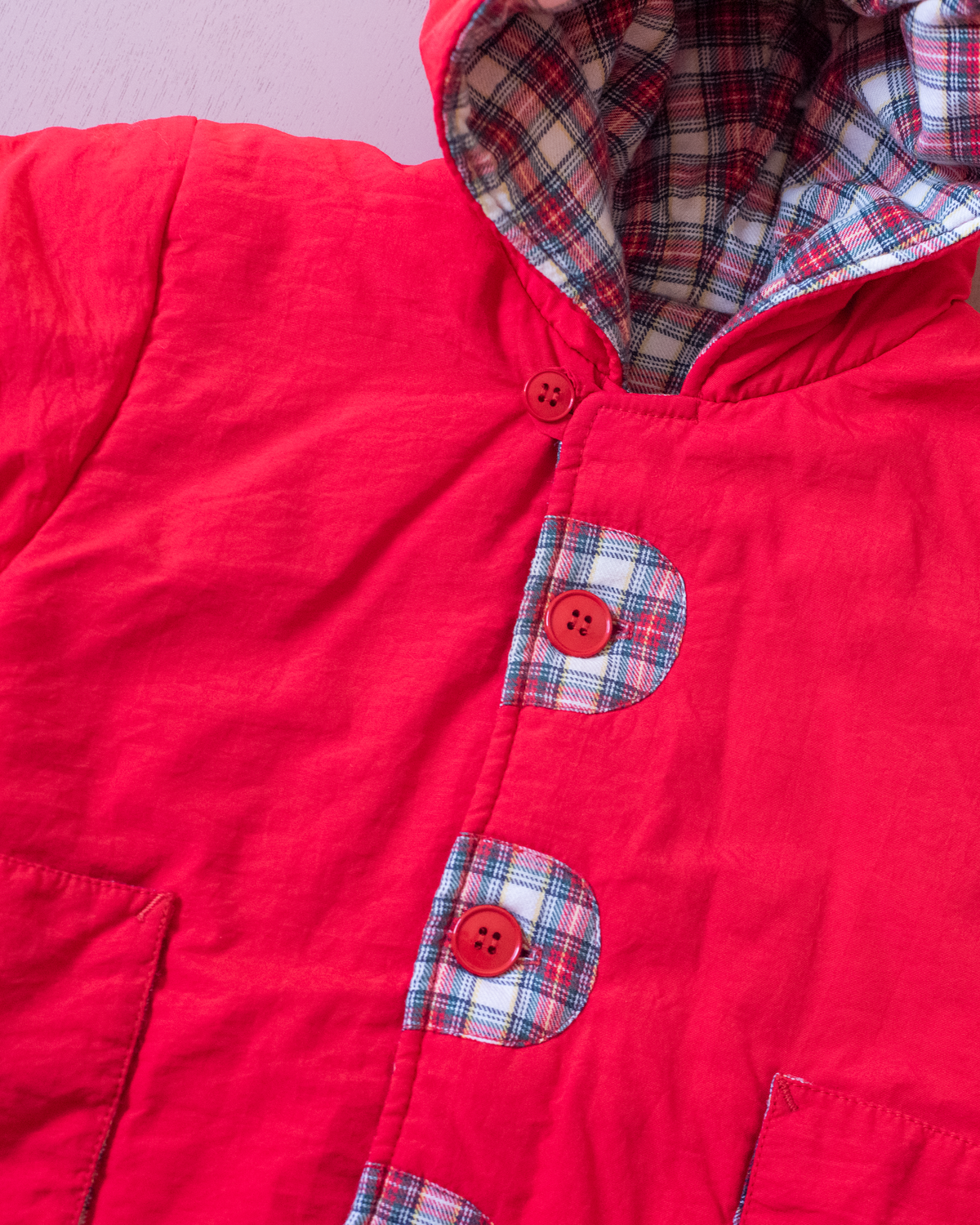 Red down jacket with checks from Yves Saint Laurent | 3-9 months