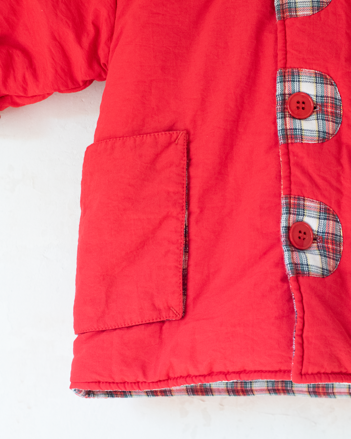 Red down jacket with checks from Yves Saint Laurent | 3-9 months
