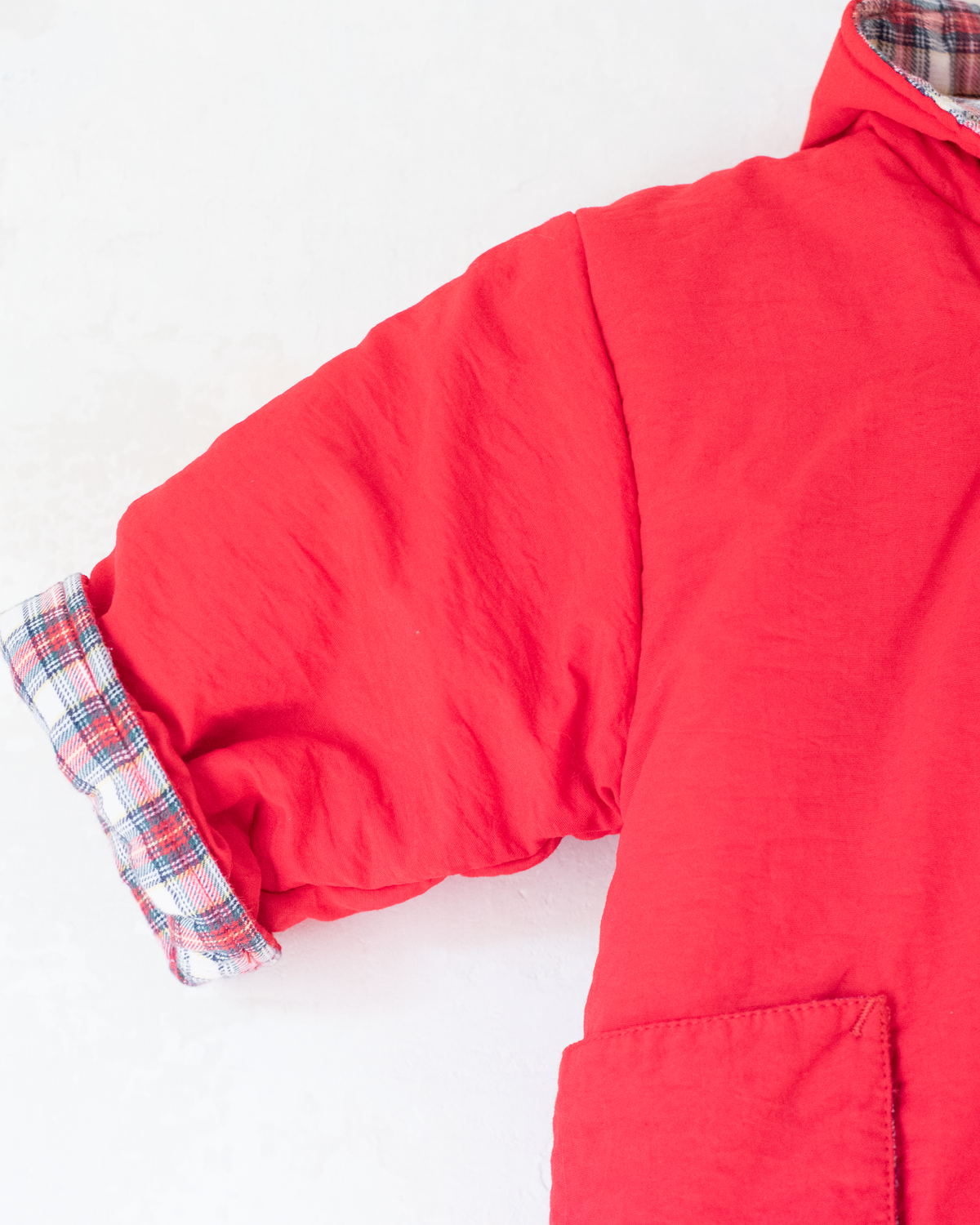 Red down jacket with checks from Yves Saint Laurent | 3-9 months
