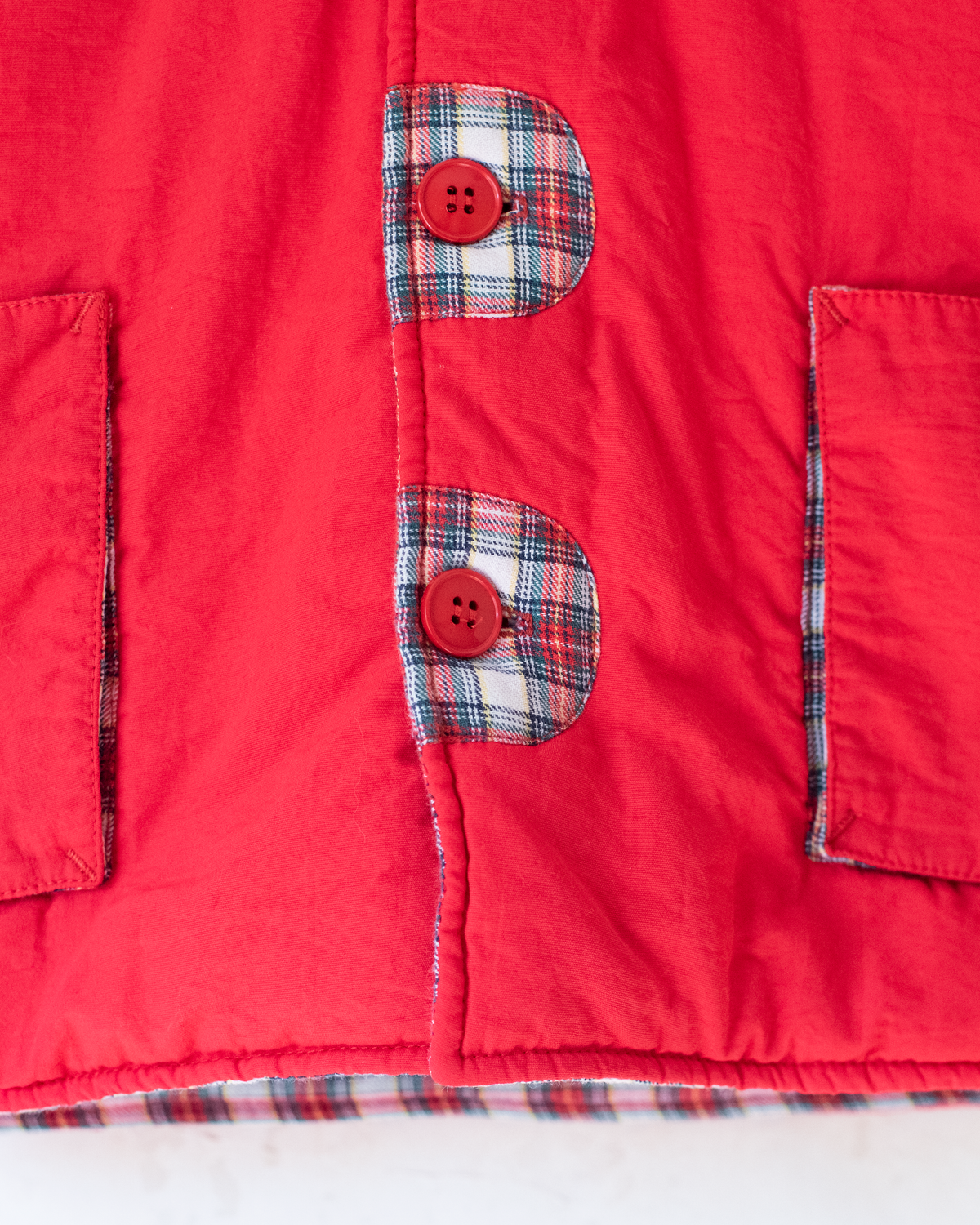 Red down jacket with checks from Yves Saint Laurent | 3-9 months