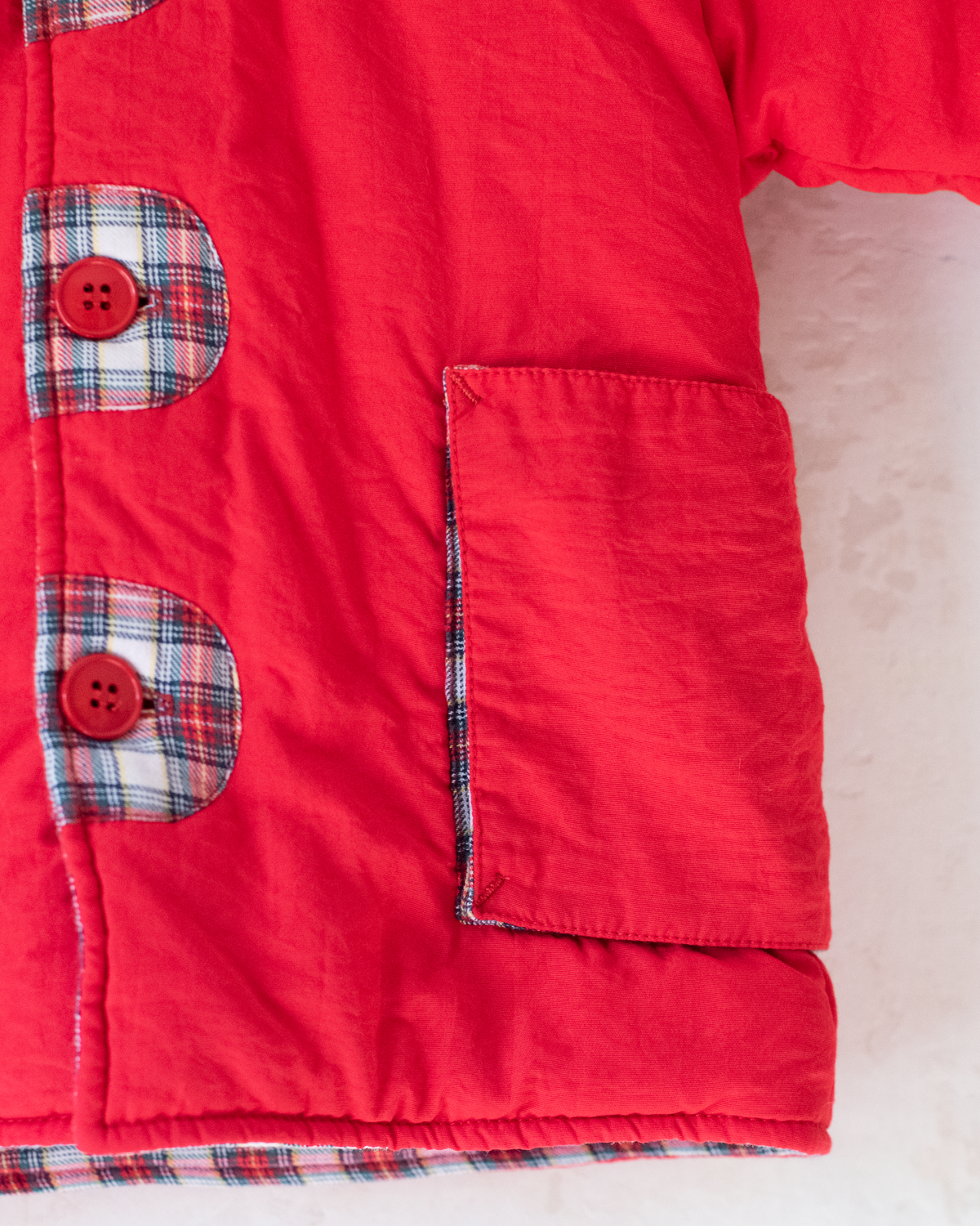 Red down jacket with checks from Yves Saint Laurent | 3-9 months