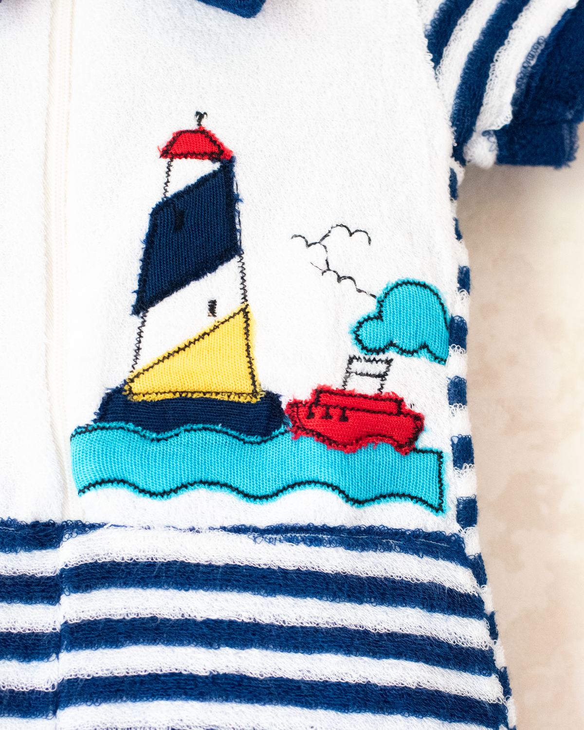 Red and white towelling overalls with stripes and a lighthouse | Spanish dead stock | 3-6 months