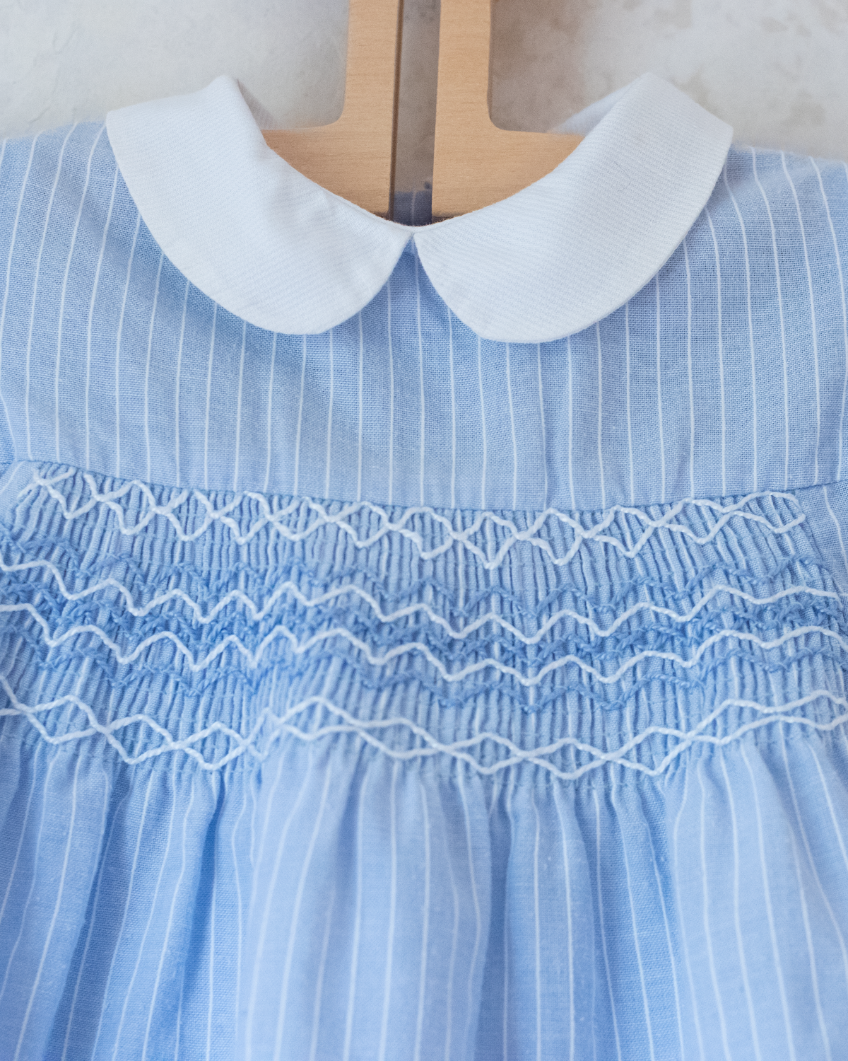 Light blue romper with delicate embroidery | 9-12 months