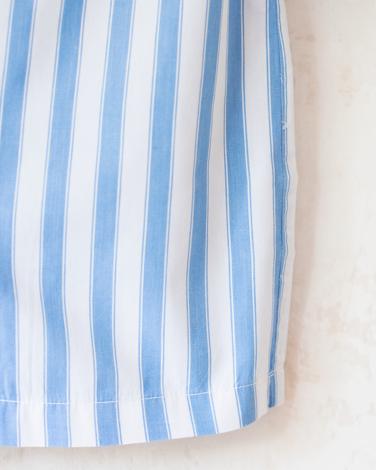 Light blue and white striped shirt with shoulder pads | 4-5 years