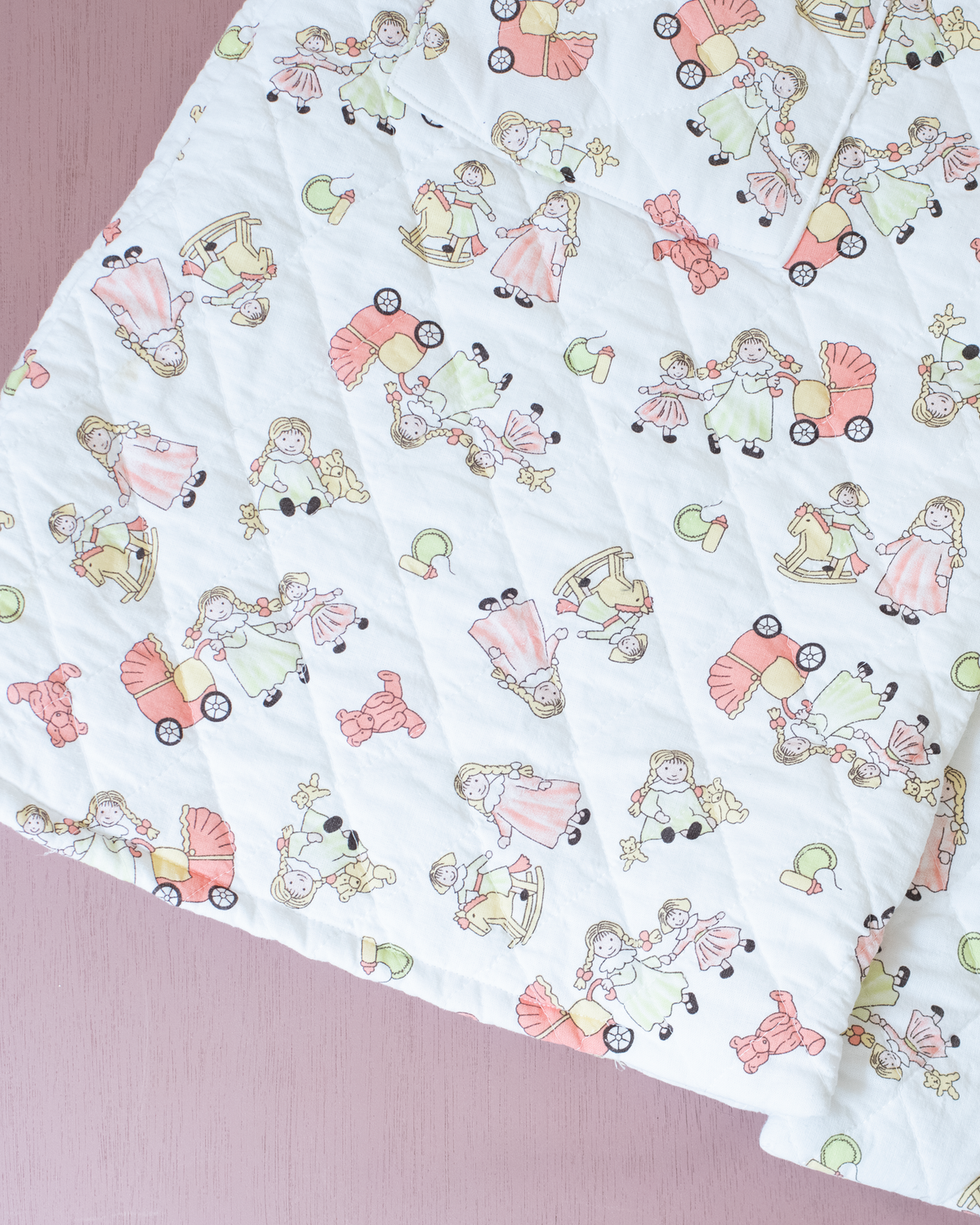 Quilted jacket with children's prints | 10-11 years