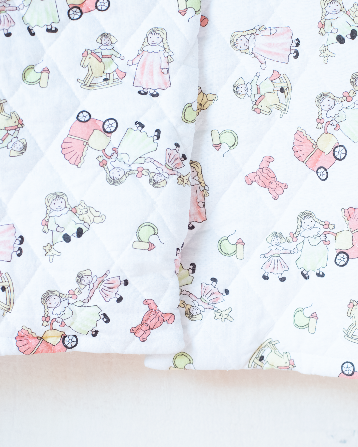 Quilted jacket with children's prints | 10-11 years