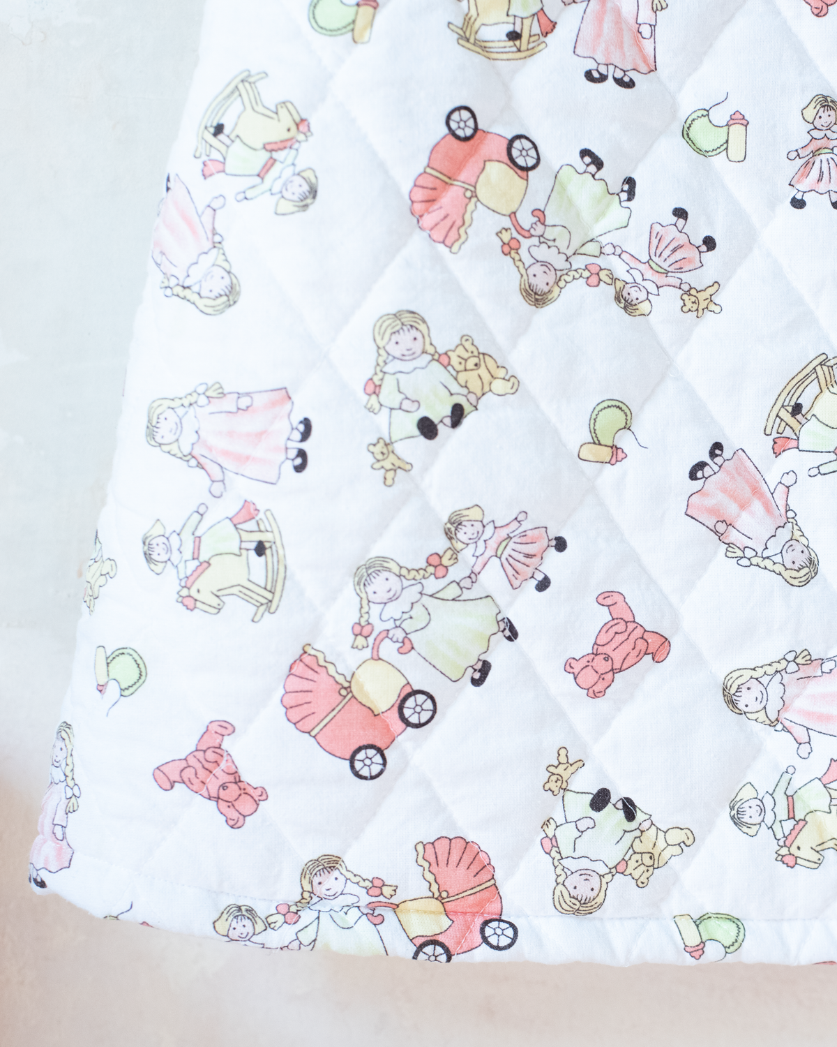 Quilted jacket with children's prints | 10-11 years