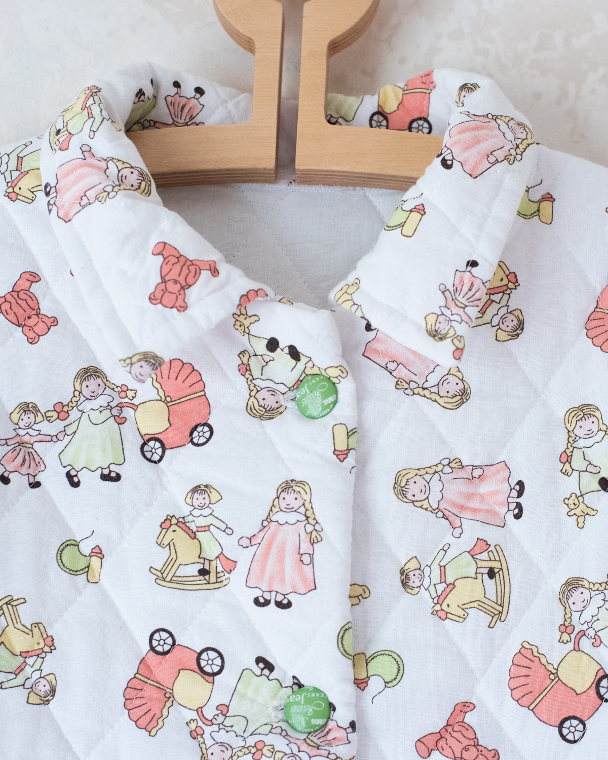 Quilted jacket with children's prints | 10-11 years