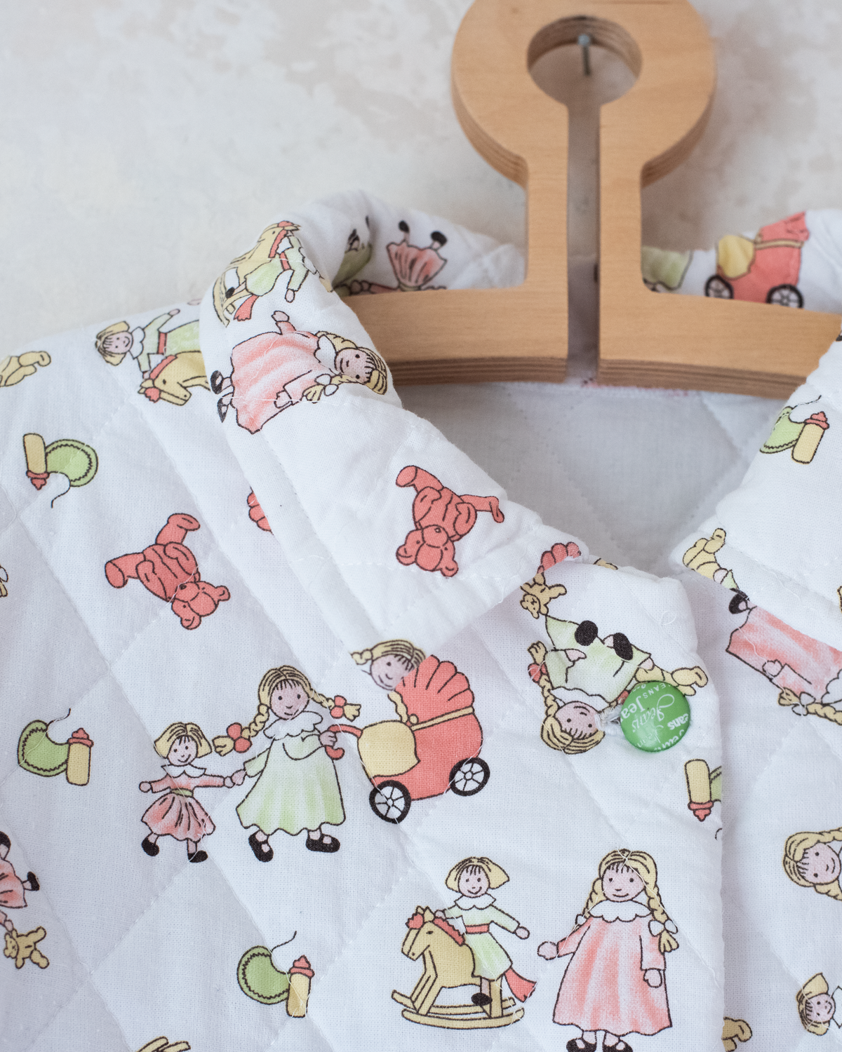 Quilted jacket with children's prints | 10-11 years