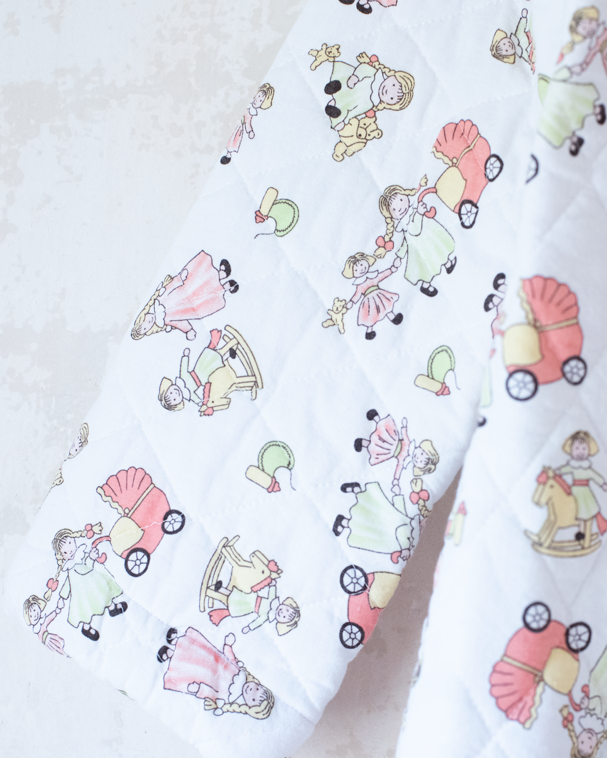 Quilted jacket with children's prints | 10-11 years