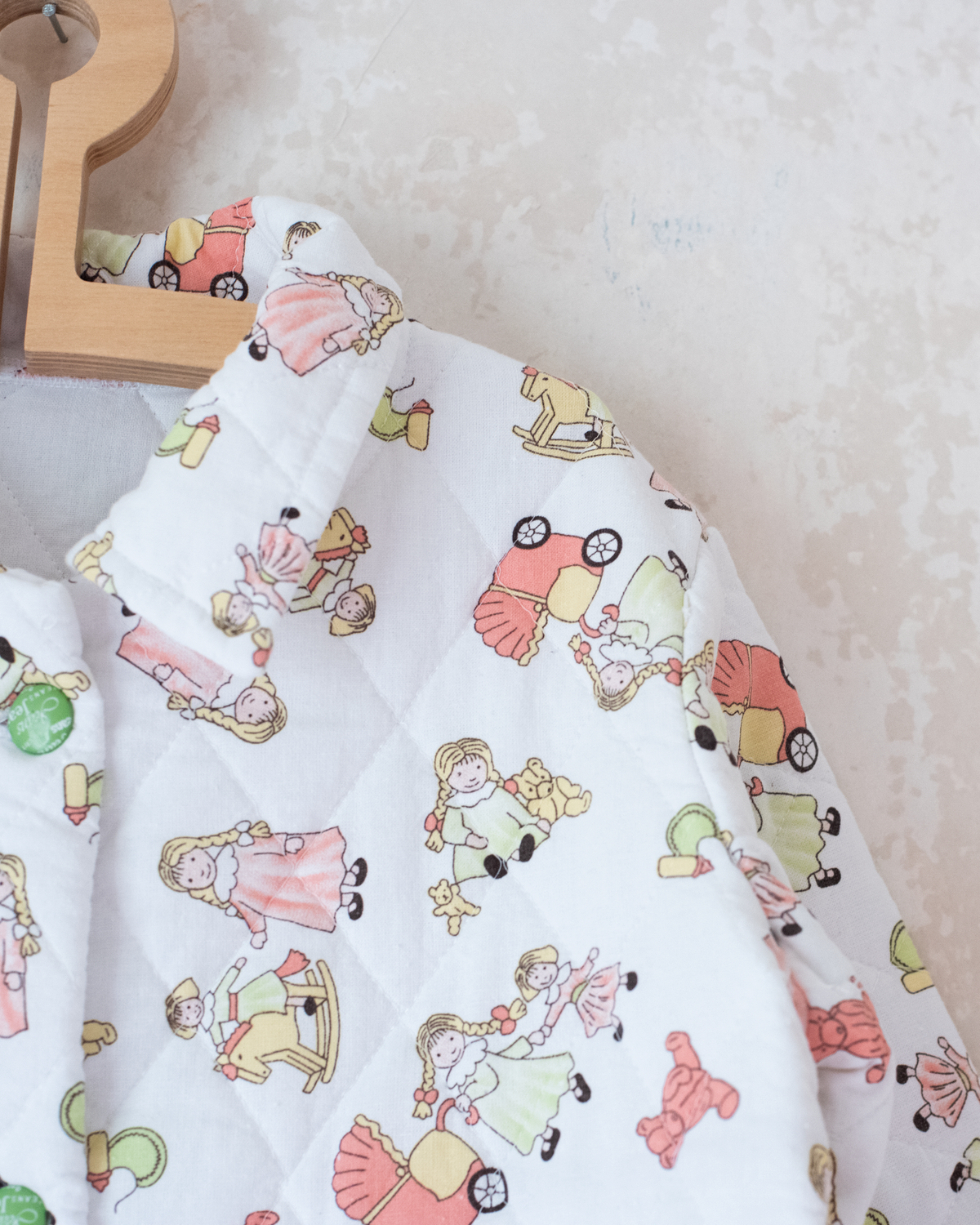 Quilted jacket with children's prints | 10-11 years