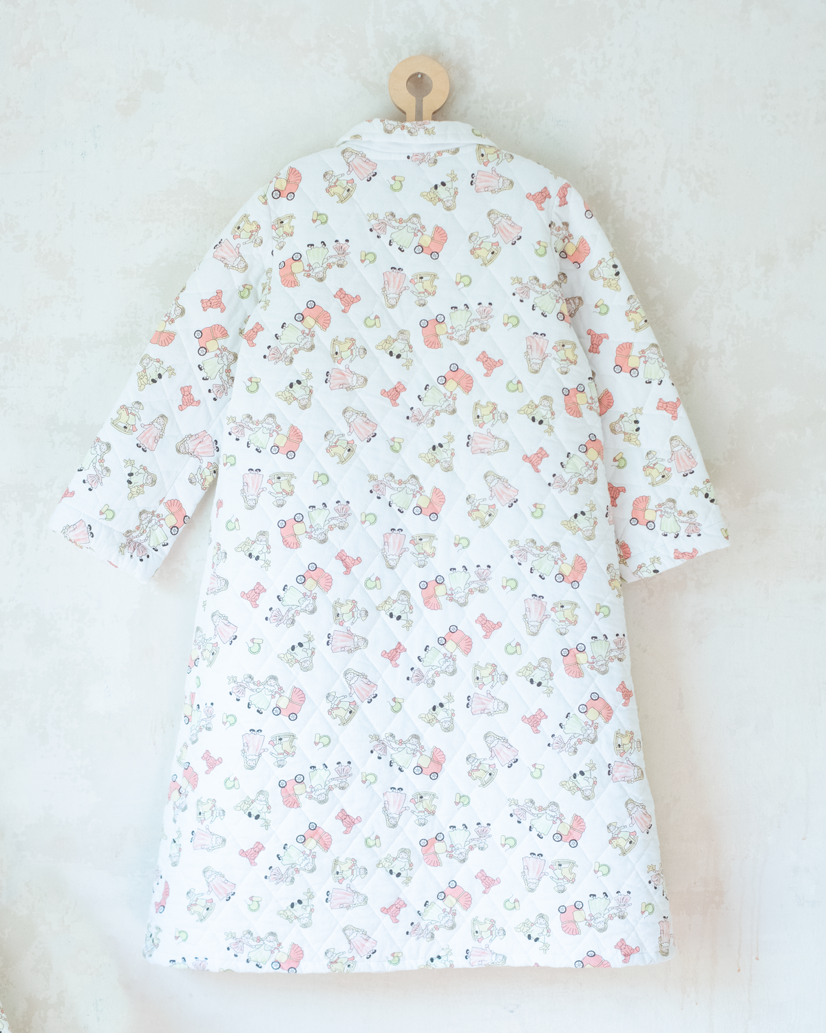 Quilted jacket with children's prints | 10-11 years