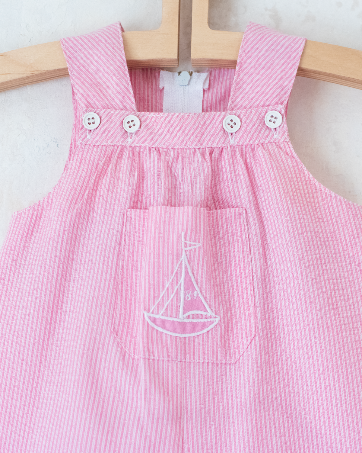 Pink striped overalls with embroidered sailboat | 6-9 months