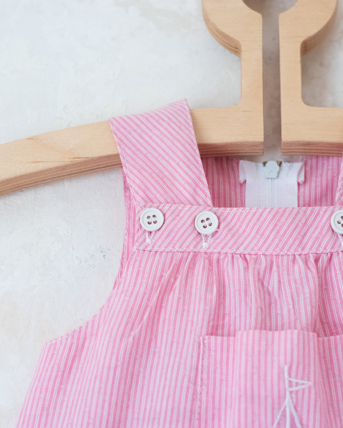 Pink striped overalls with embroidered sailboat | 6-9 months