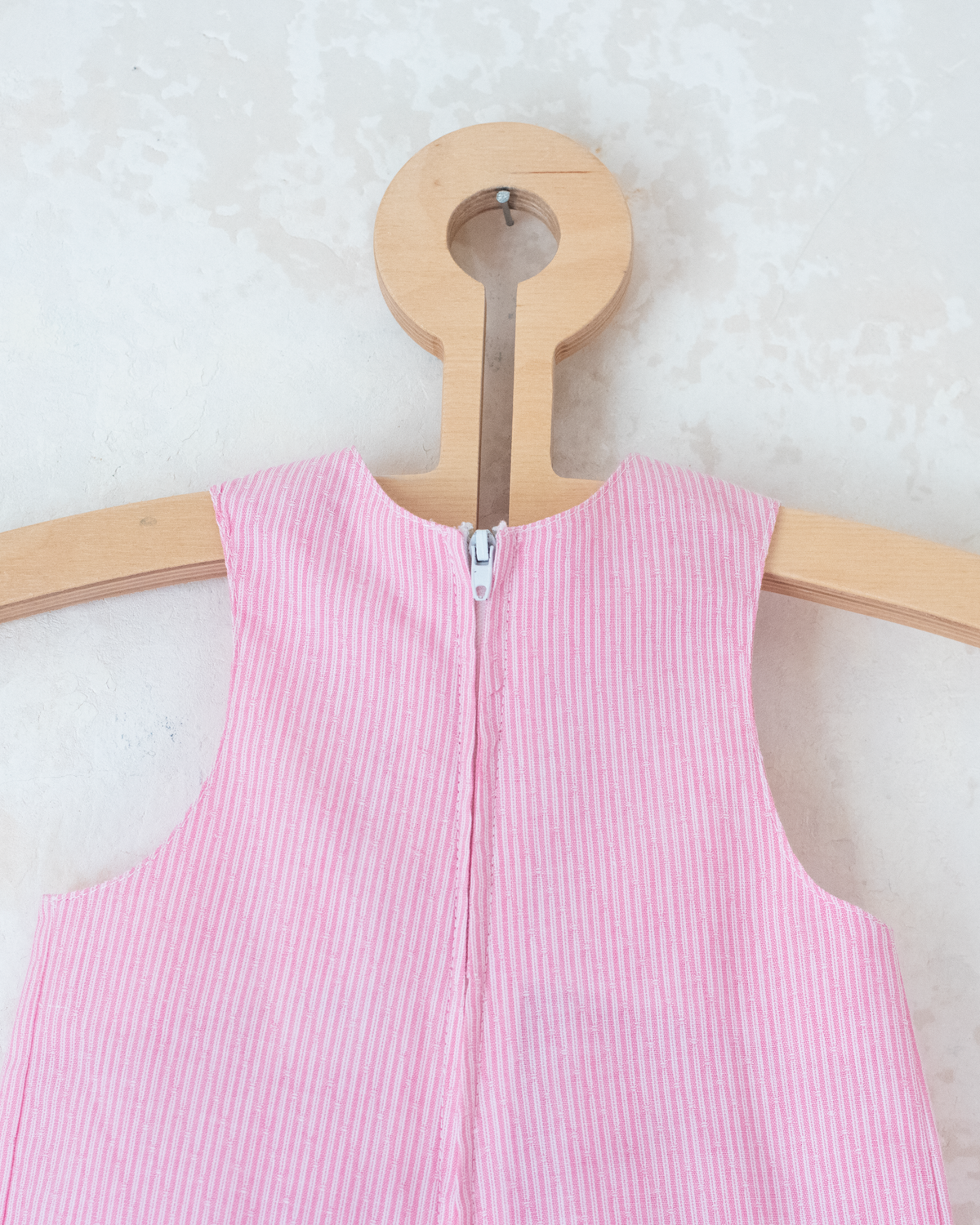 Pink striped overalls with embroidered sailboat | 6-9 months