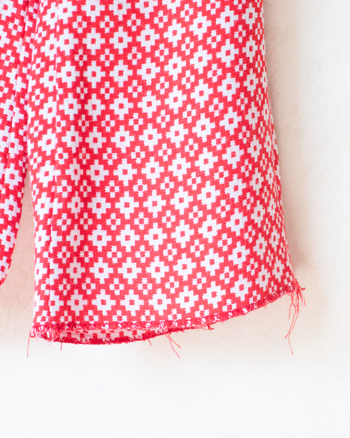 Red and white seventies-style overall | 2-3 years