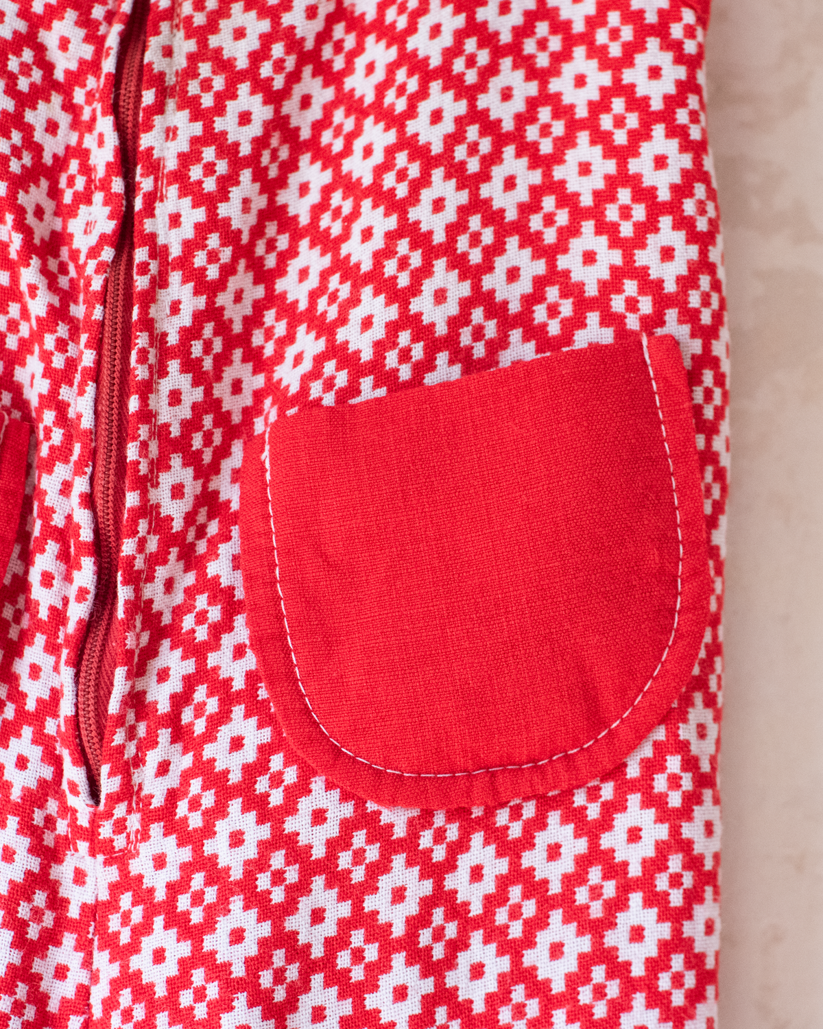 Red and white seventies-style overall | 2-3 years