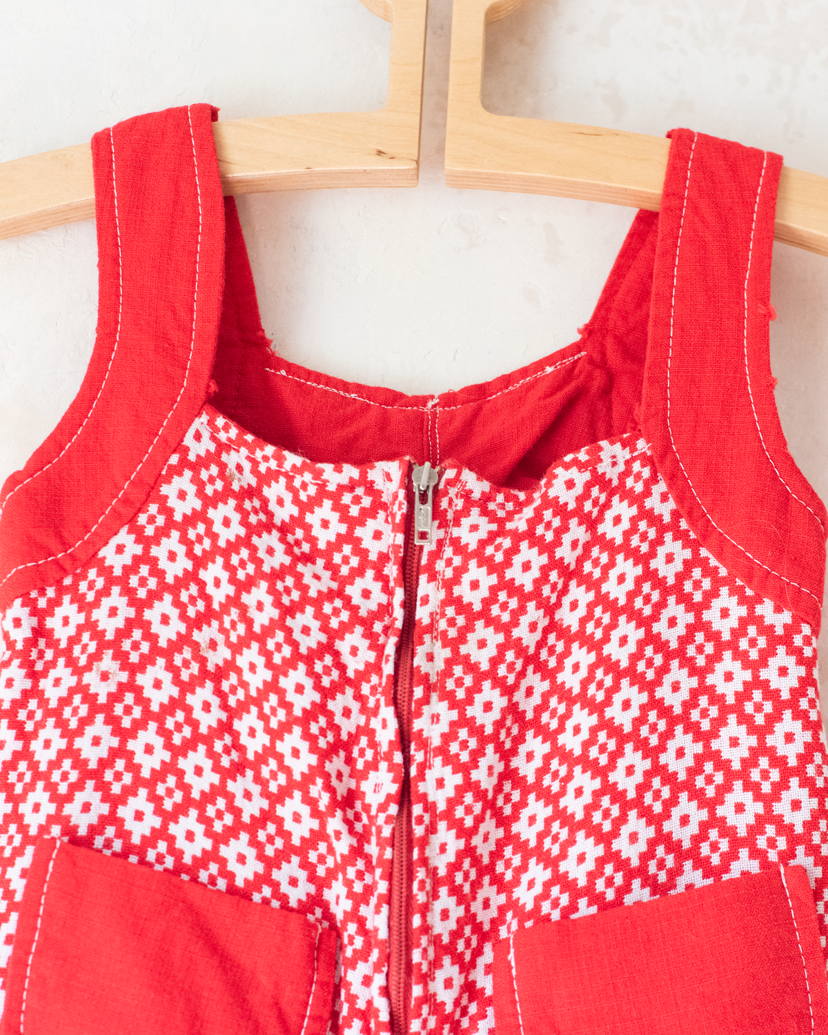 Red and white seventies-style overall | 2-3 years