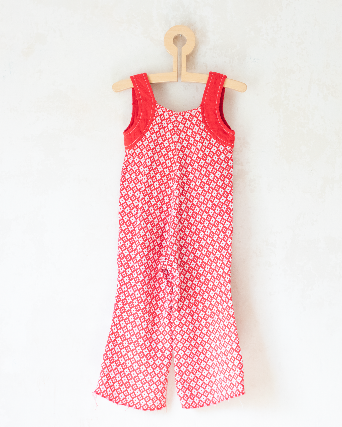 Red and white seventies-style overall | 2-3 years