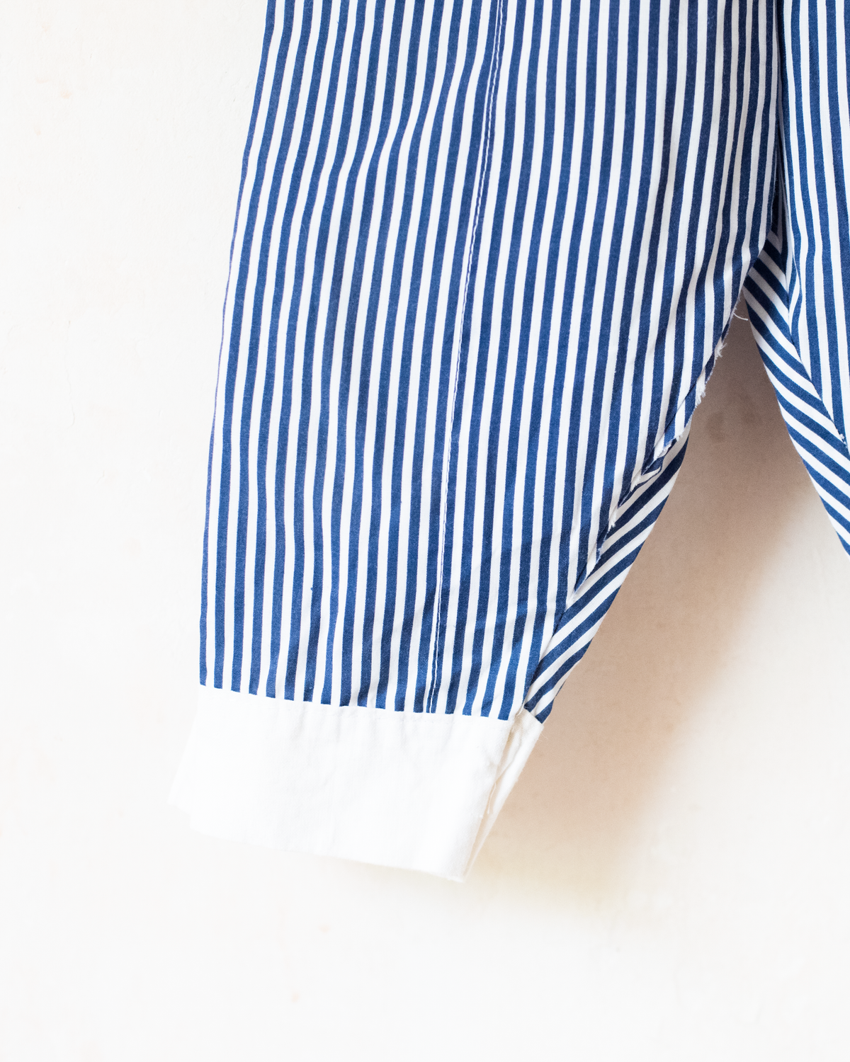 Striped overalls with embroidered red anchor | 12-18 months
