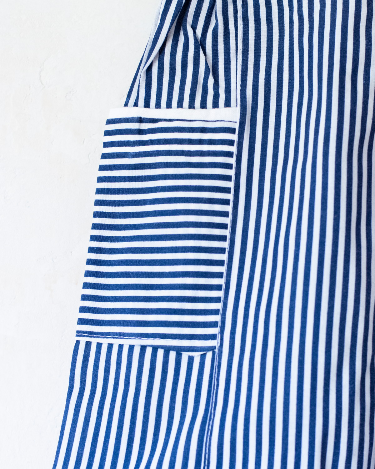 Striped overalls with embroidered red anchor | 12-18 months