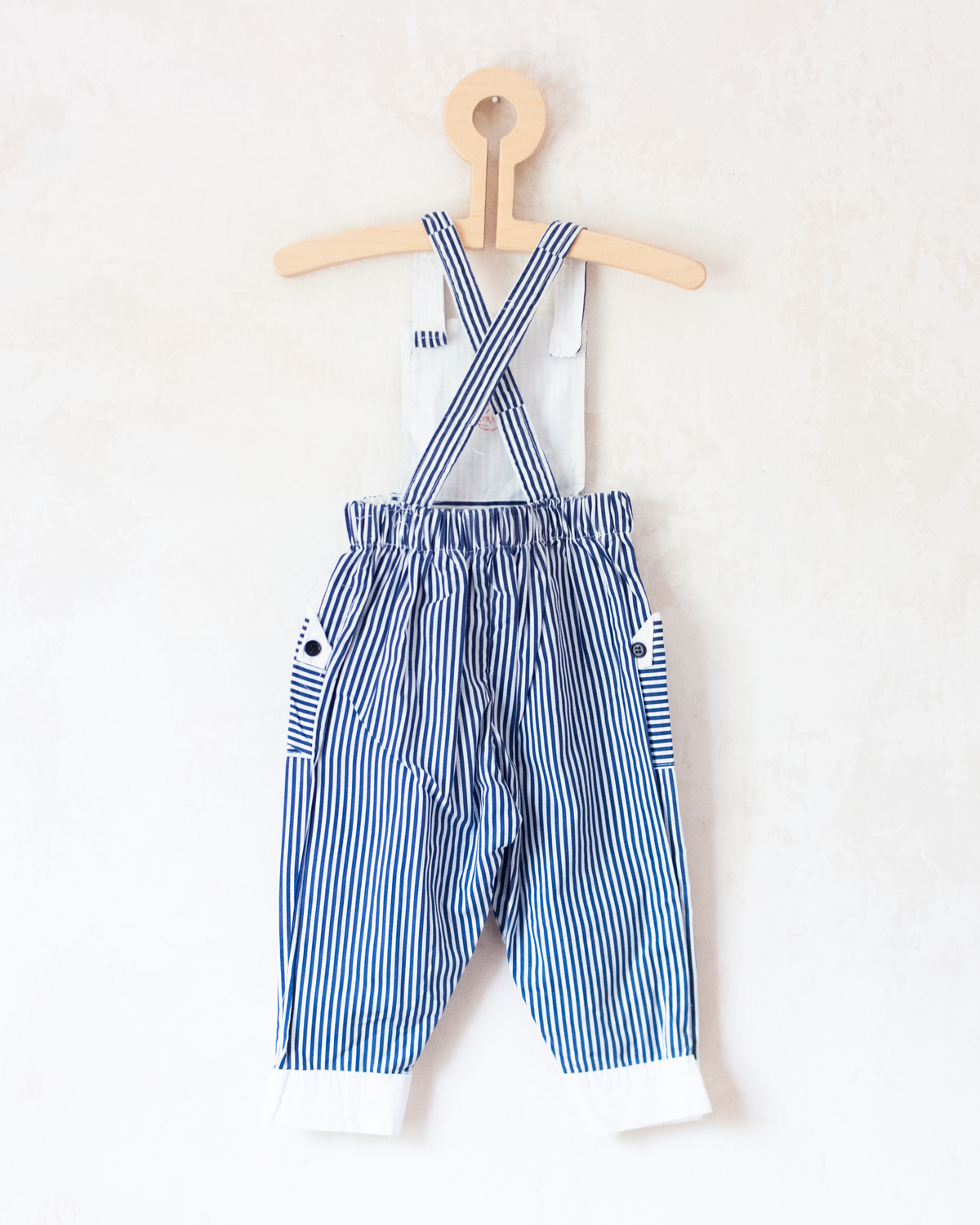 Striped overalls with embroidered red anchor | 12-18 months
