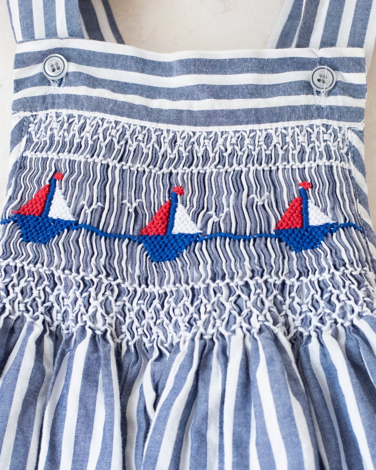 All-in-one with stripes and embroidered sailboats | 6-9 months