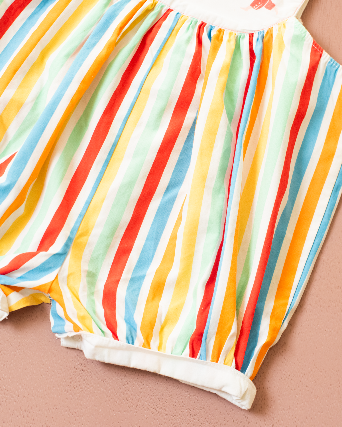 Colorful fruit-print jumpsuit by Yves Saint Laurent | 9-12 months